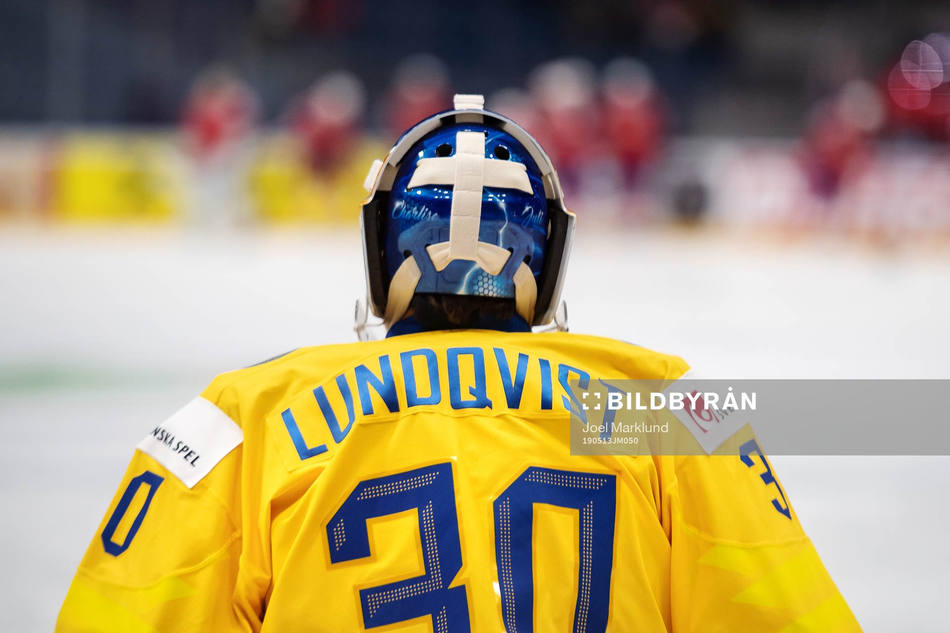 Goaltender Henrik Lundqvist of Sweden has his daughters
