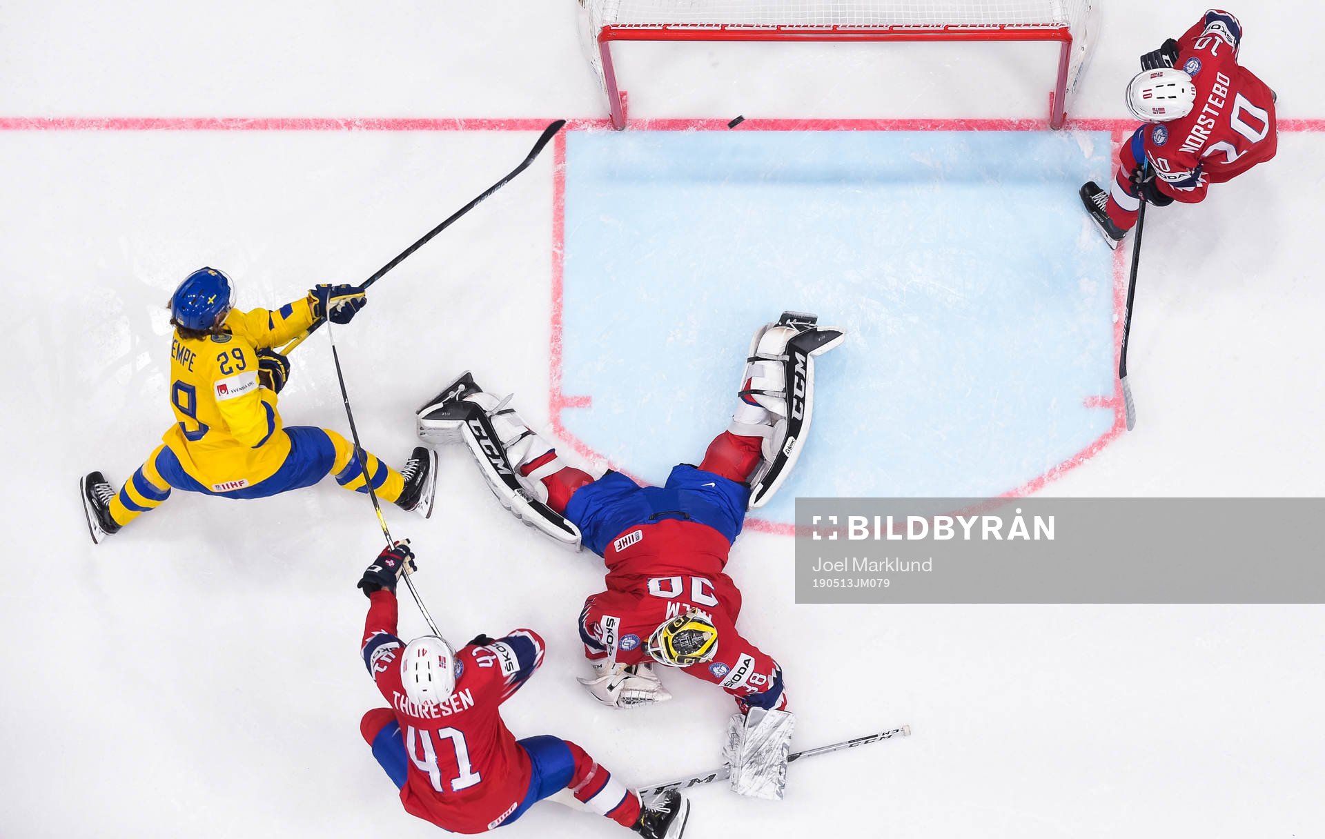 Mario Kempe of Sweden scores the 0-6 goal behind goaltender