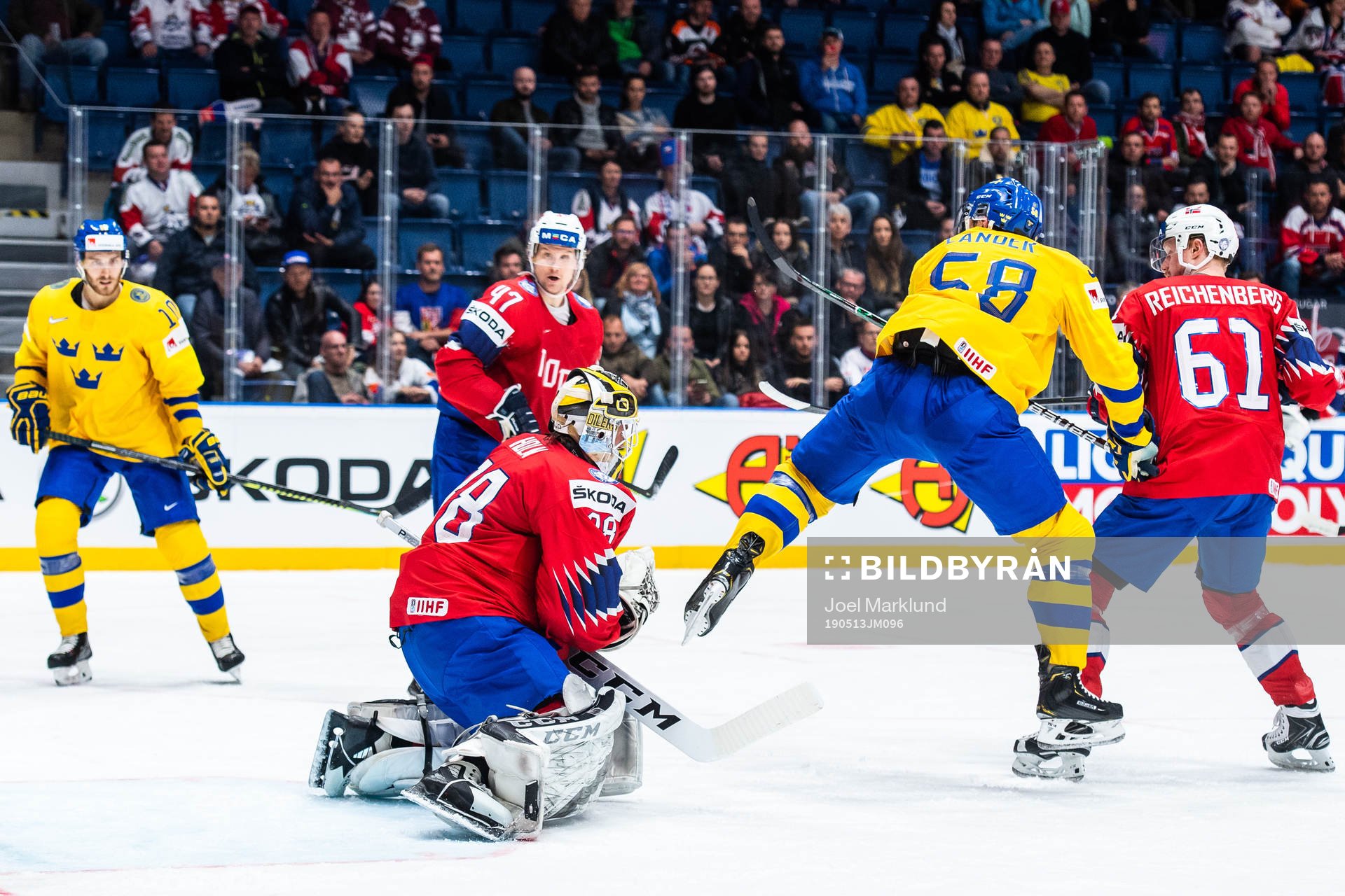 Anton Lander of Sweden against goaltender Henrik Holm of