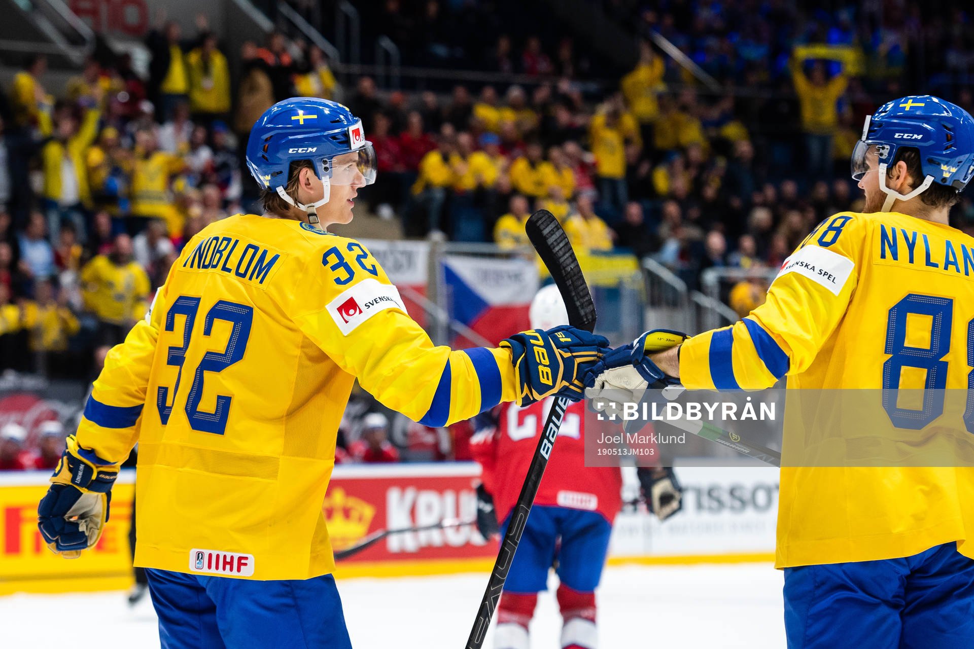 Oskar Lindblom and William Nylander of Sweden celebrate the