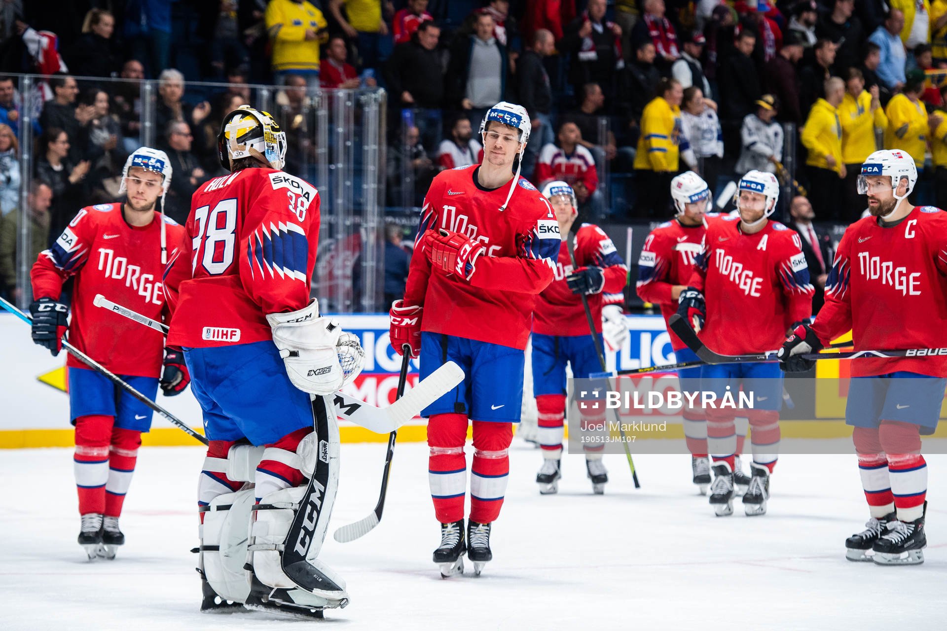 Goaltender Henrik Holm and Sondre Olden of Norway look