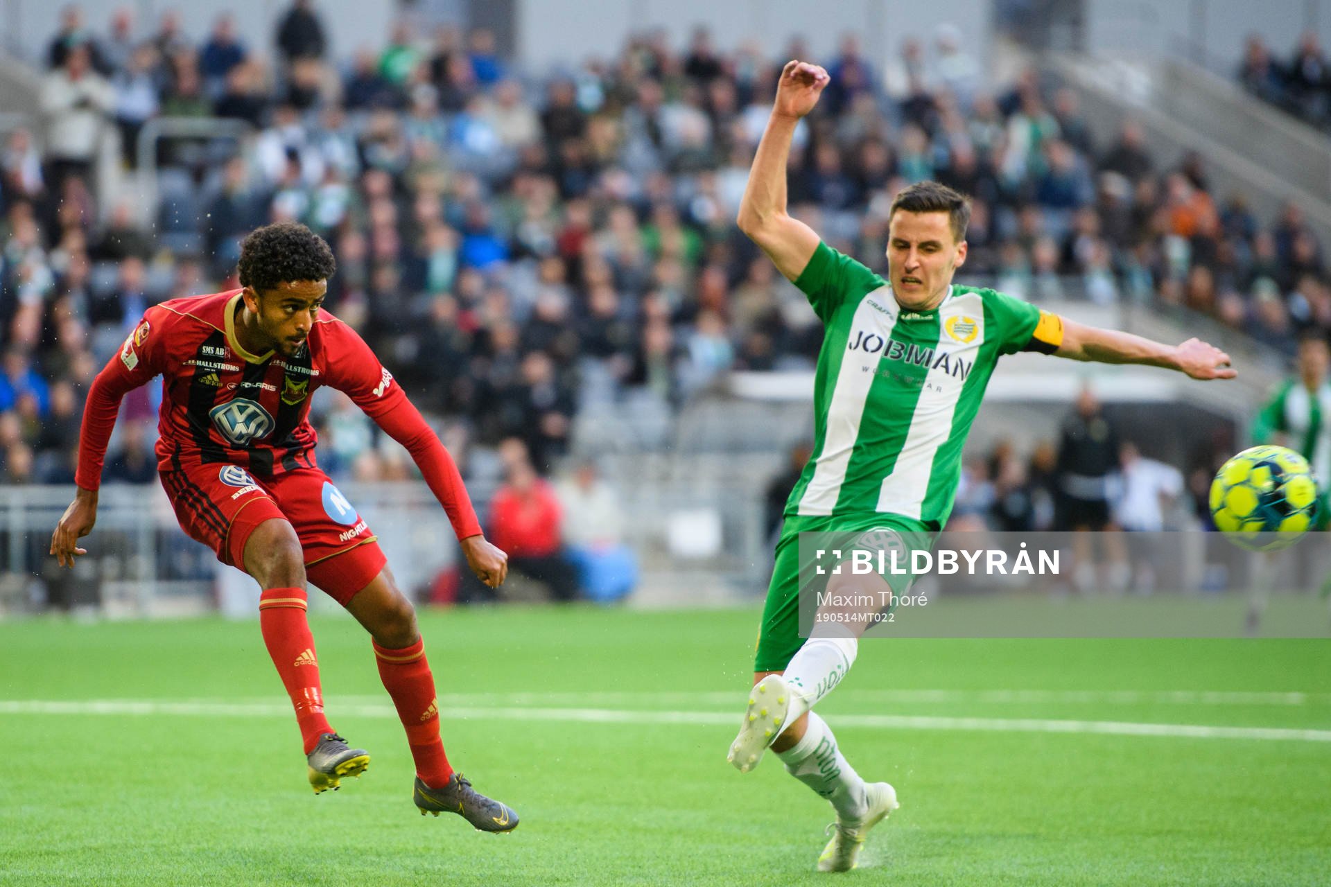 Östersunds Tesfaldet Tekie och Hammarbys Jeppe Andersen under fotbollsmatchen i Allsvenskan mellan Hammarby och Östersund den 14 maj Stockholm.