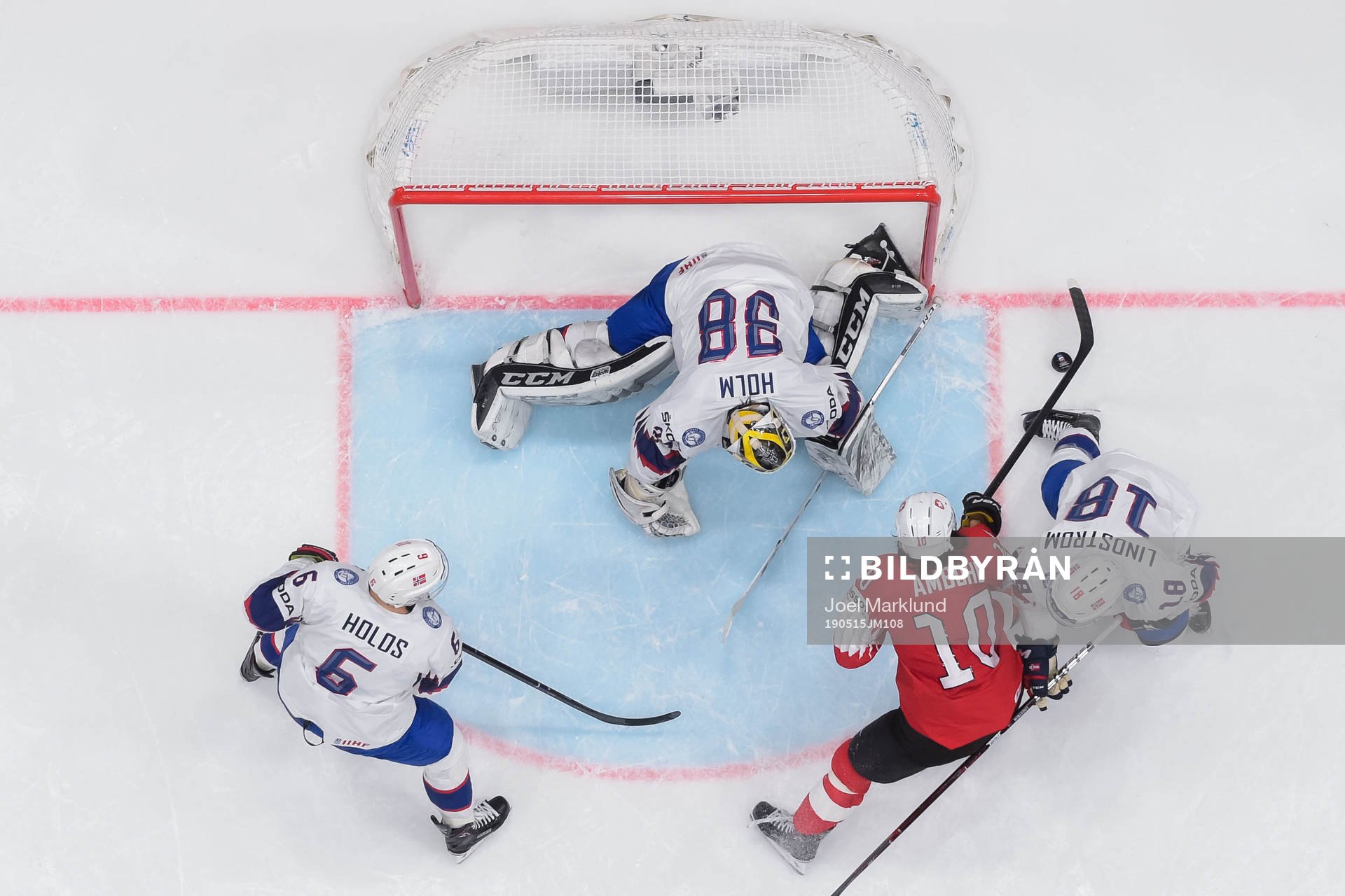 Jonas Holøs, goaltender Henrik Holm and Tobias Lindström