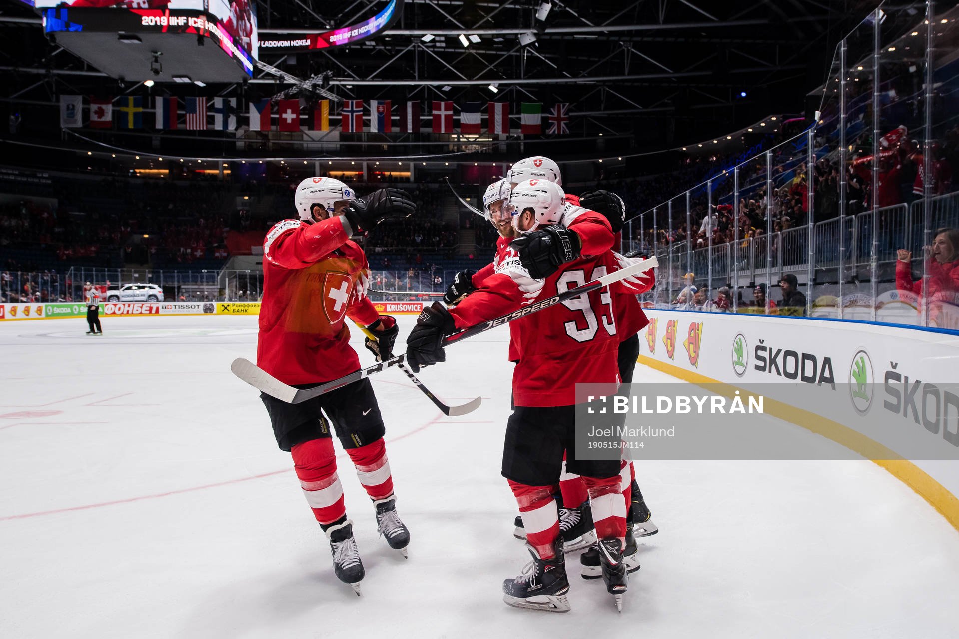 Gregory Hofmann of Switzerland celebrates with teammates