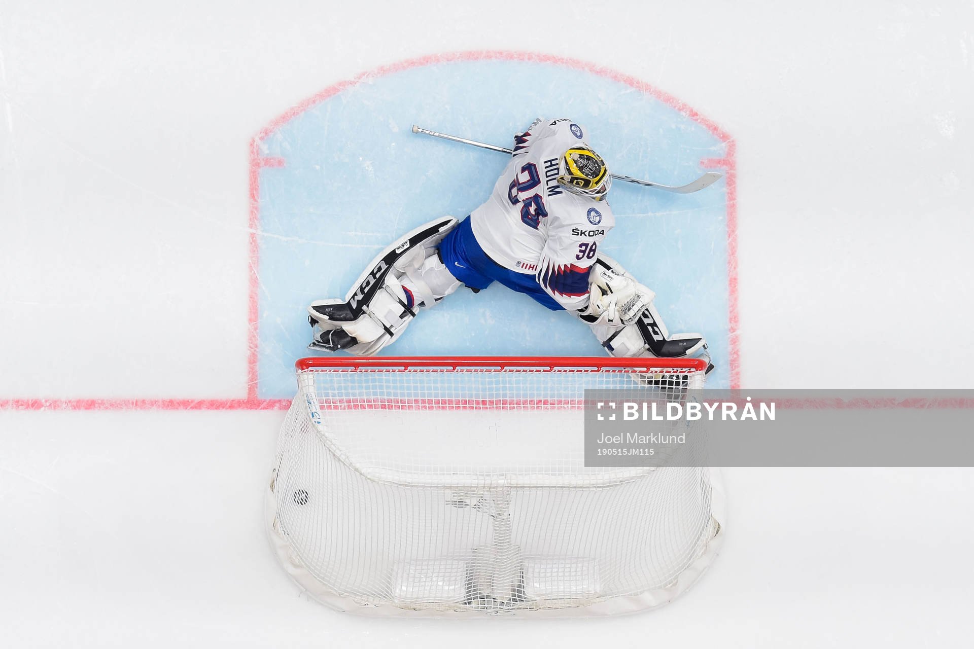 Goaltender Henrik Holm of Norway looks dejected