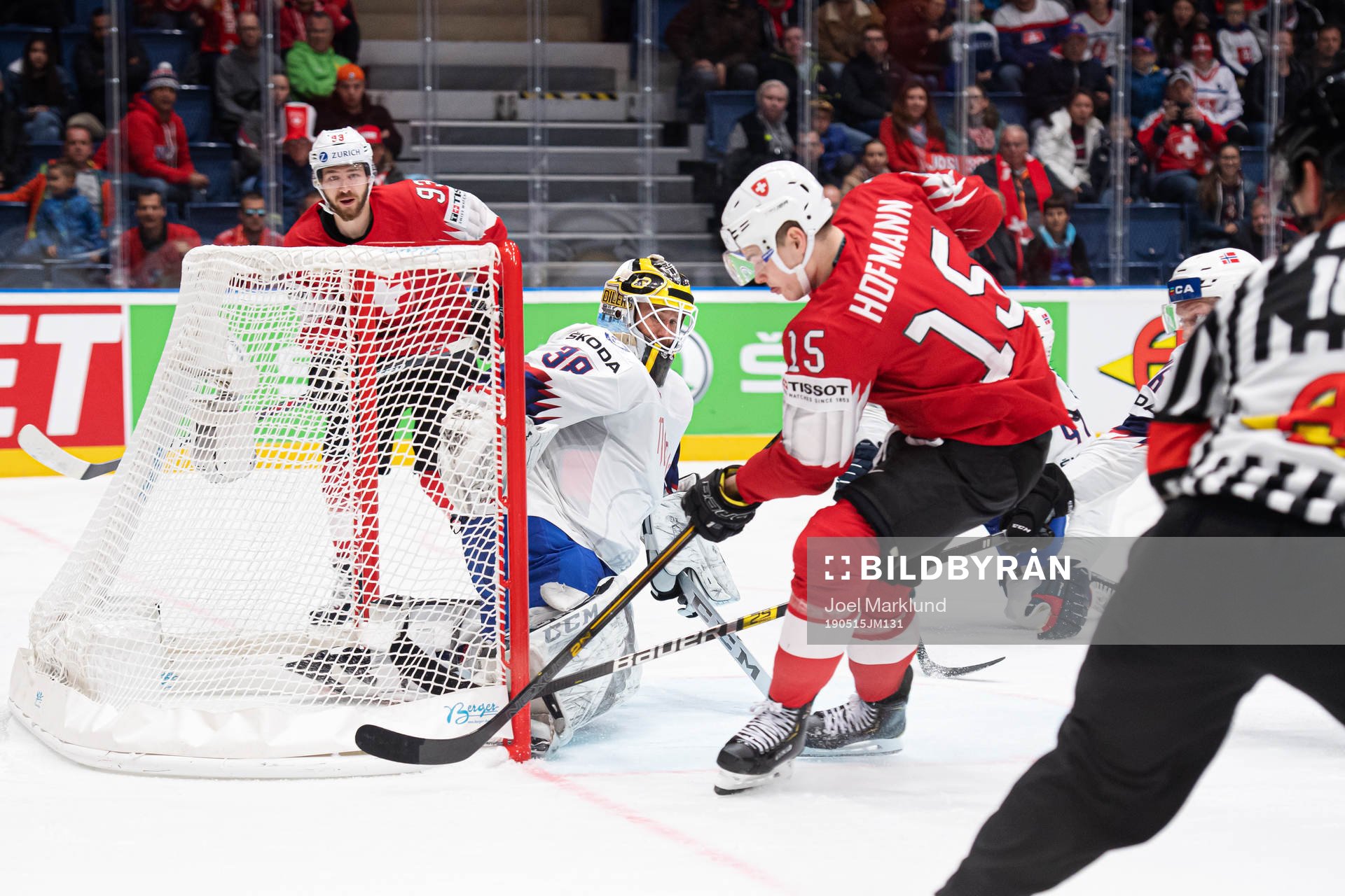 Gregory Hofmann (R) of Switzerland scores 3-0 behind