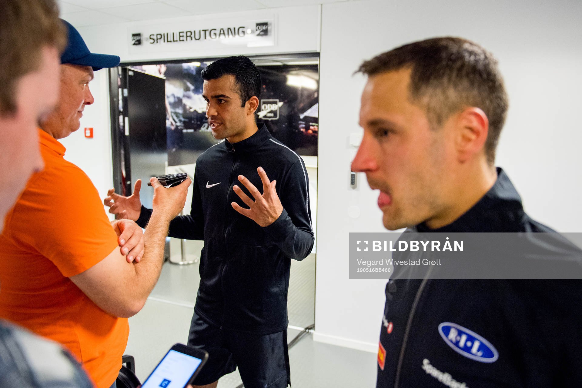 Rohit Saggi, referee, and Mads Reginiussen of Ranheim