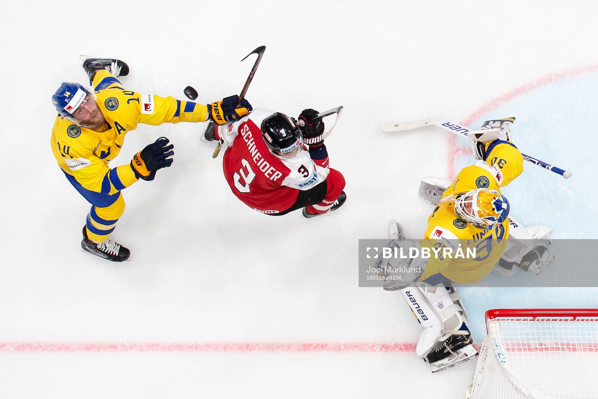 Mattias Ekholm and goaltender Henrik Lundqvist of Sweden in