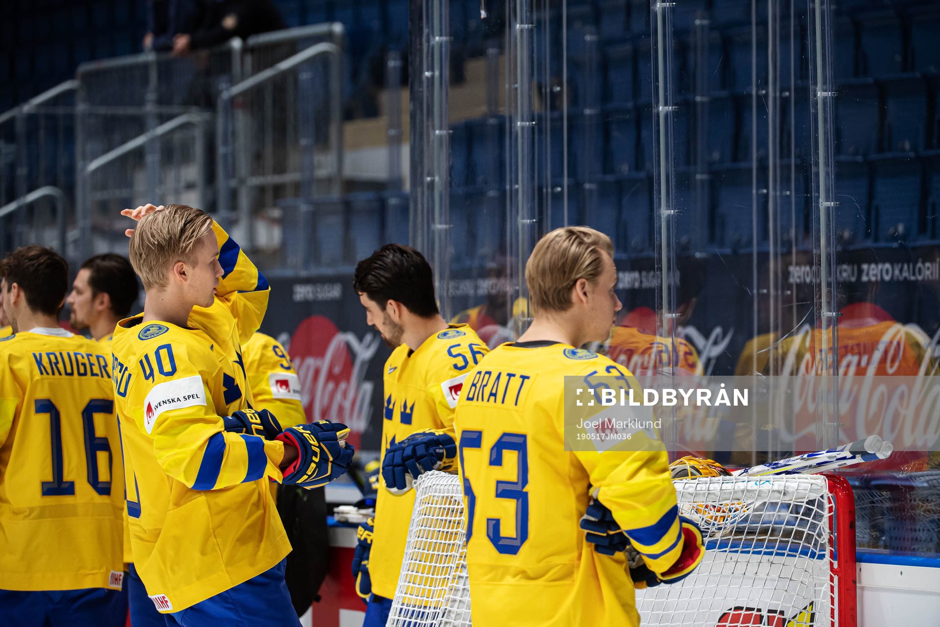 Elias Pettersson and Jesper Bratt of Sweden adjusts their