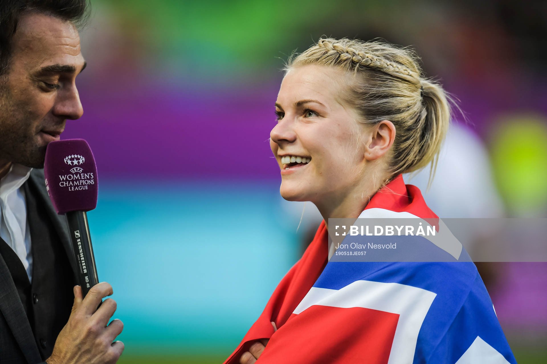 Ada Hegerberg of Lyon celebrates with a Norwegian flag