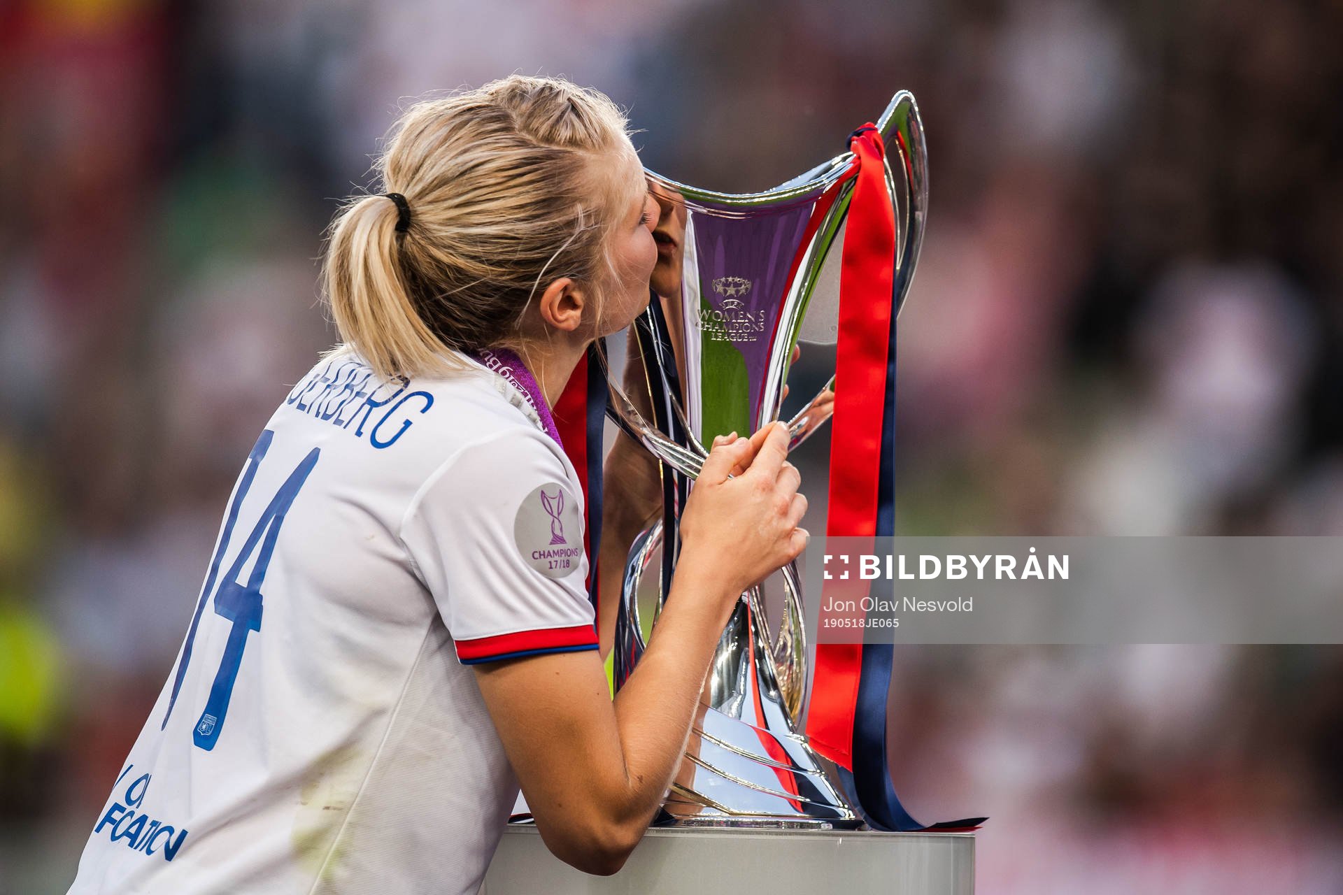 Ada Hegerberg of Lyon kisses the trophy