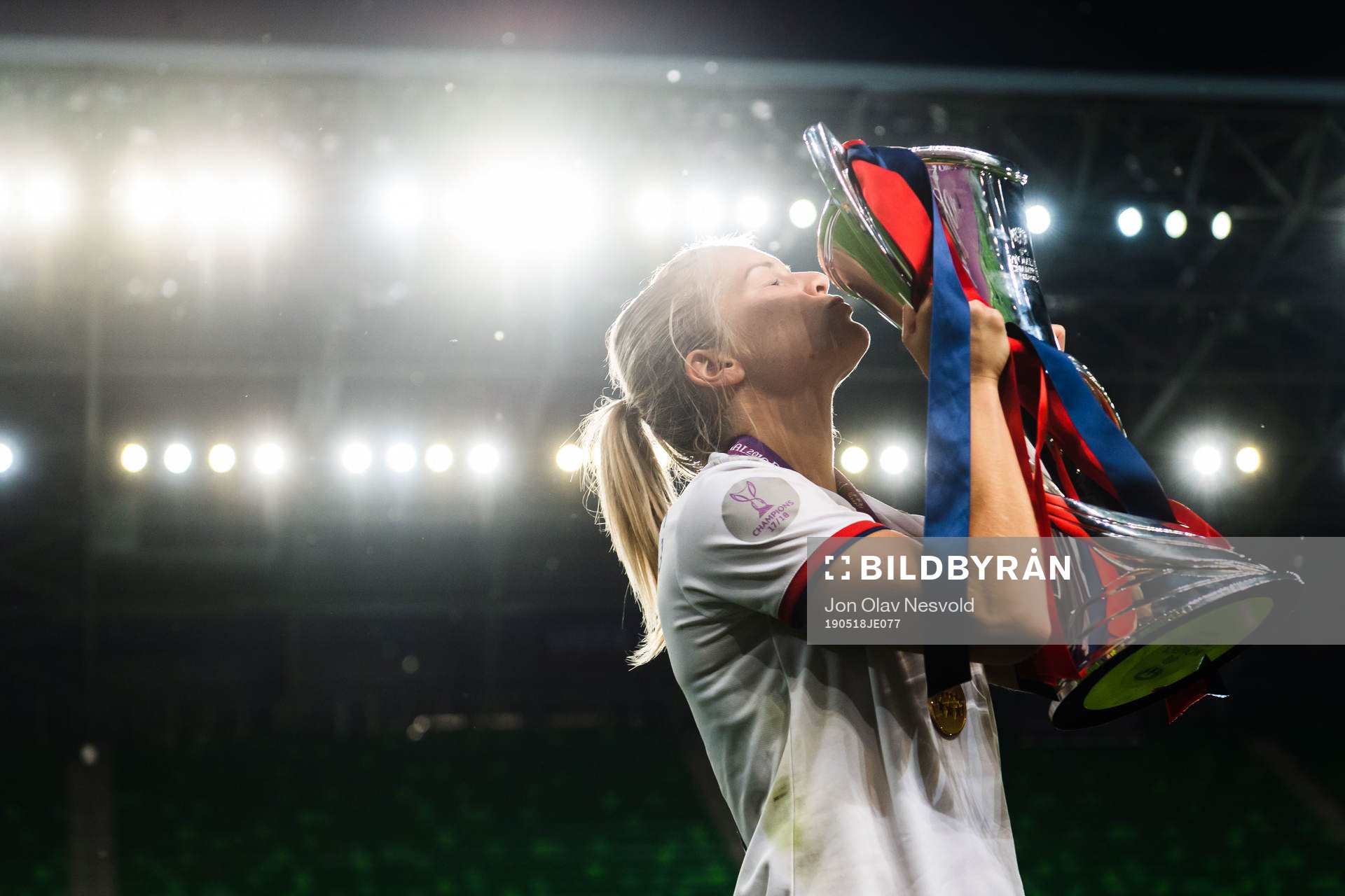 Ada Hegerberg of Lyon poses for a portrait with the trophy