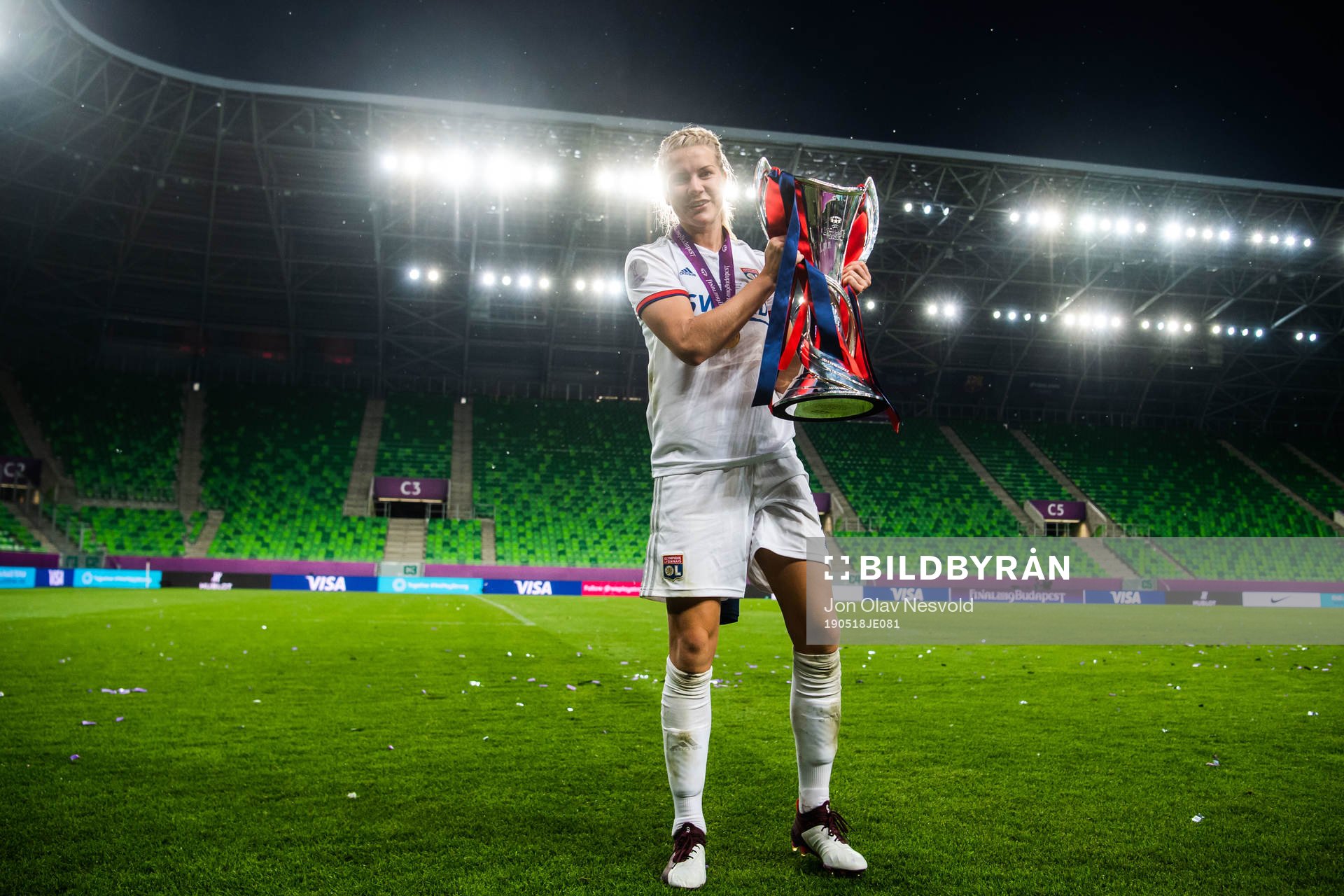 Ada Hegerberg of Lyon poses for a portrait with the trophy
