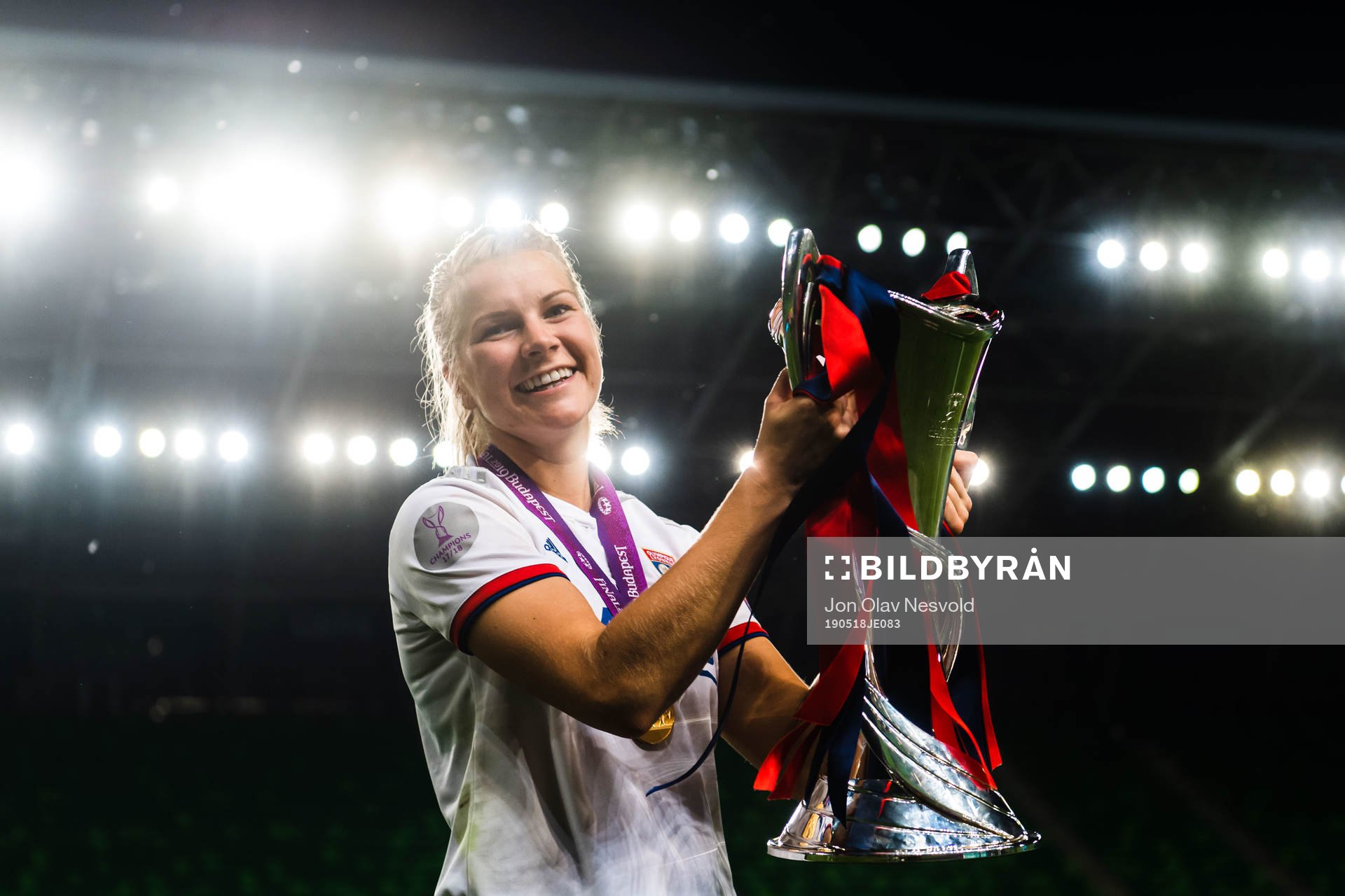 Ada Hegerberg of Lyon poses for a portrait with the trophy