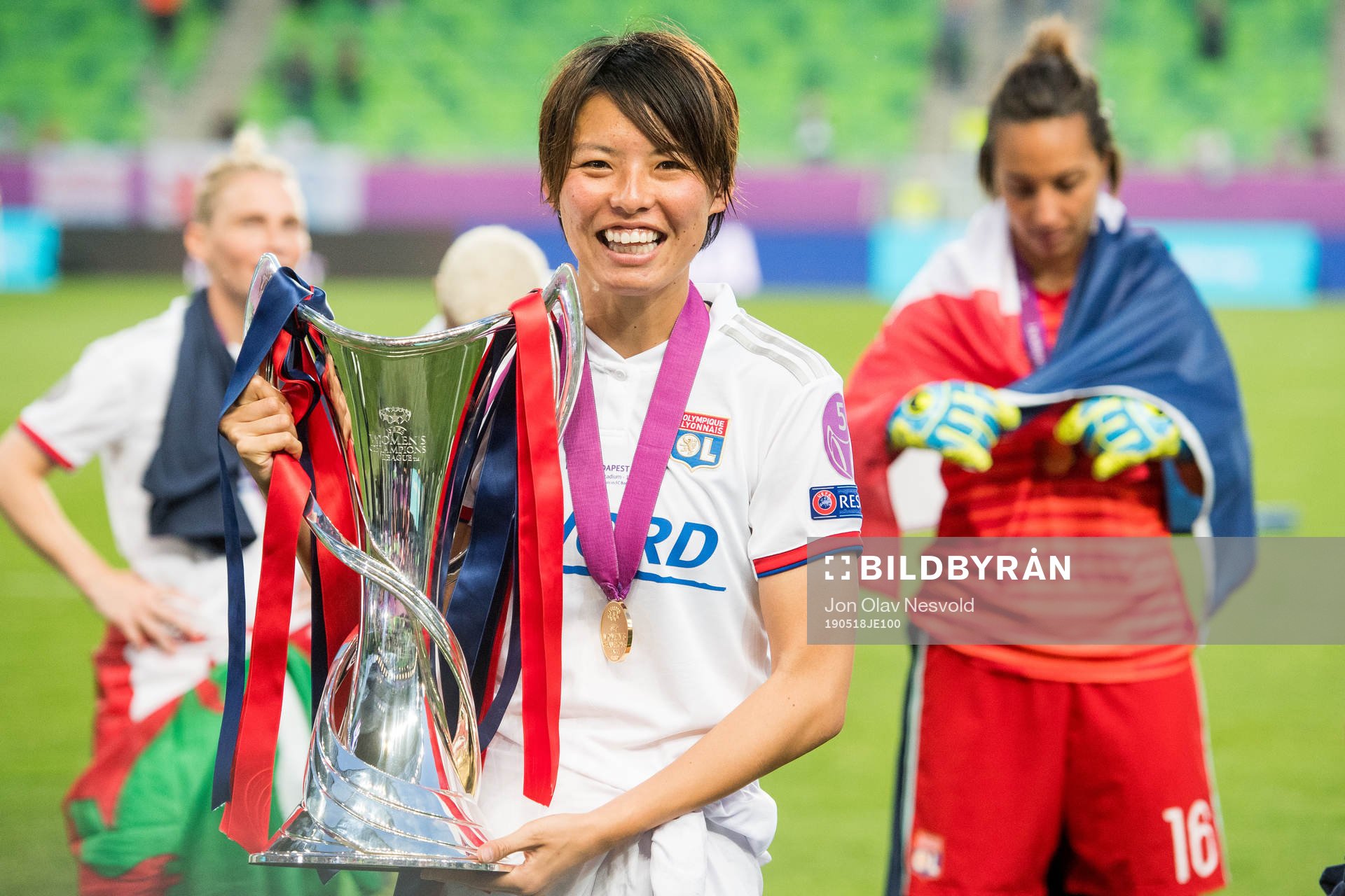 Saki Kumagai of Lyon poses with the trophy