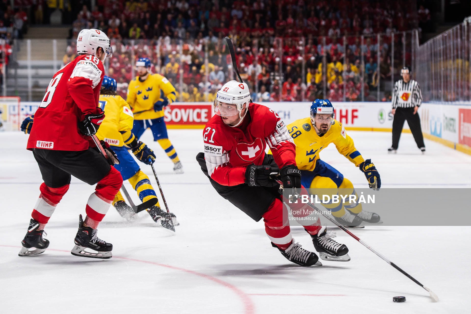Kevin Fiala of Switzerland and Anton Lander of Sweden