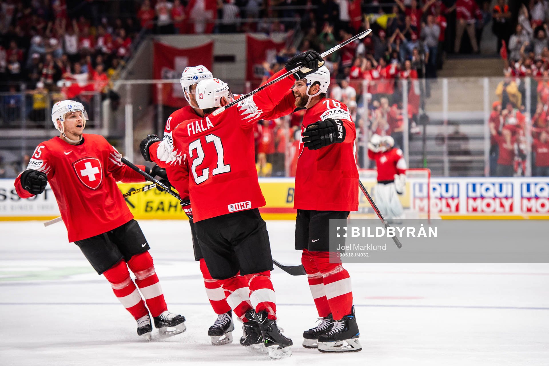 Joel Genazzi of Switzerland celebrate with teammates
