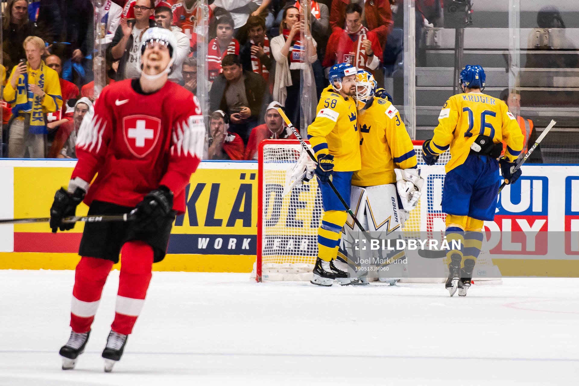 Roman Josi of Switzerland looks dejected while Anton Lande,