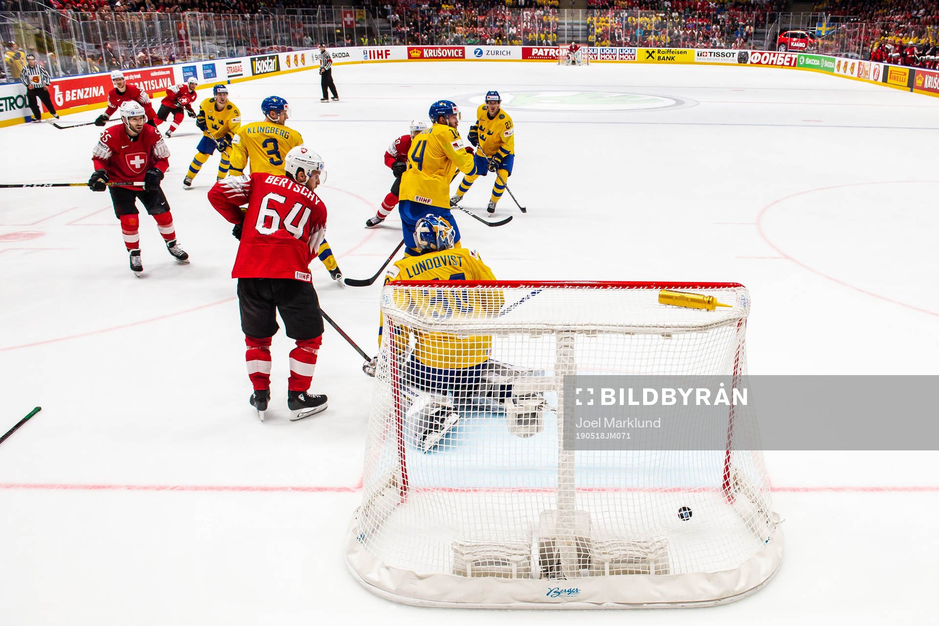 Gaetan Haas of Switzerland scores 3-3 behind goaltender