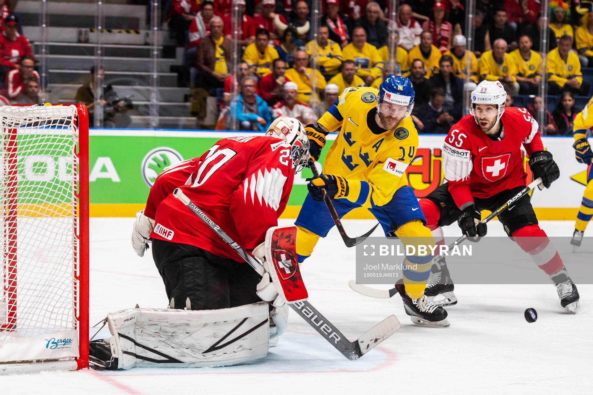 Mattias Ekholm of Sweden against goaltender Reto Berra and