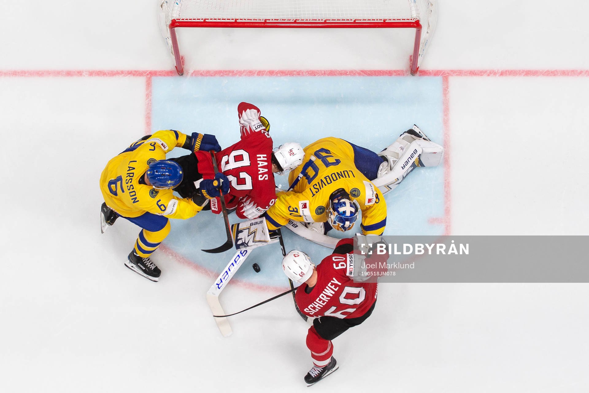 Adam Larsson and goaltender Henrik Lundqvist of Sweden in