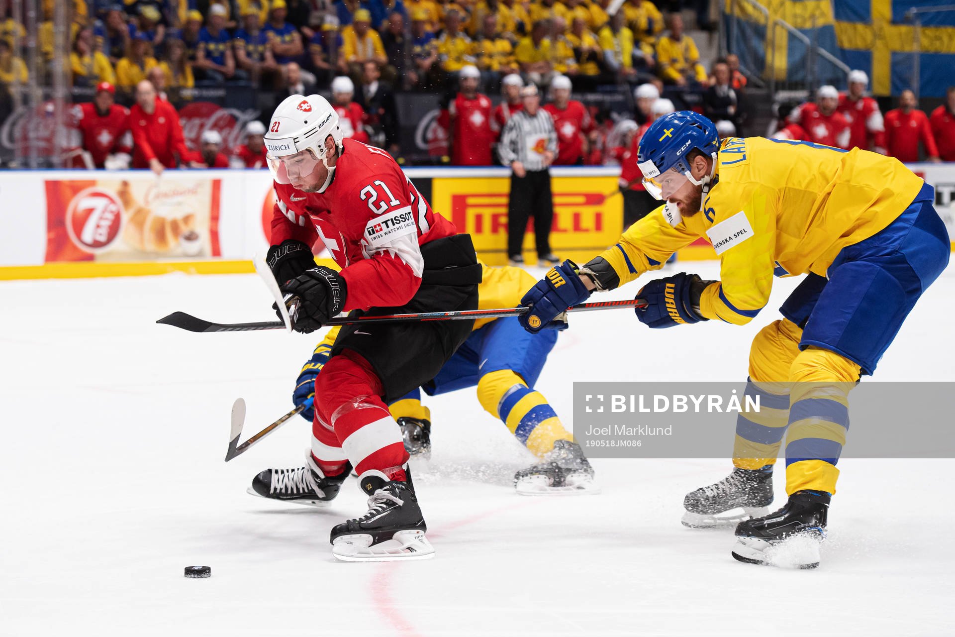 Kevin Fiala of Switzerland and Adam Larsson of Sweden