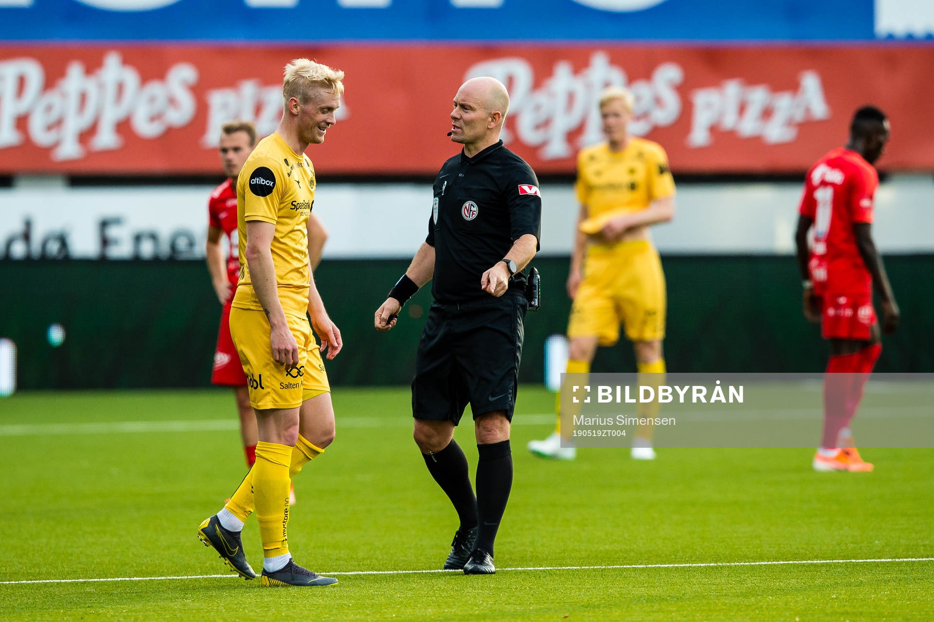 Geir André Herrem of Bodø/Glimt and Dag Vidar Hafsås, referee, during the Eliteserien match between Bodø/Glimt and Brann on May 19, 2019 in Bodø.
