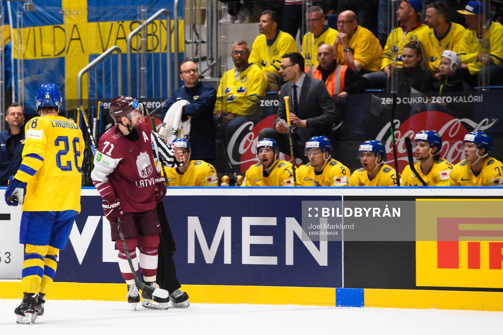 Roberts Bukarts of Latvia celebrates in front of the
