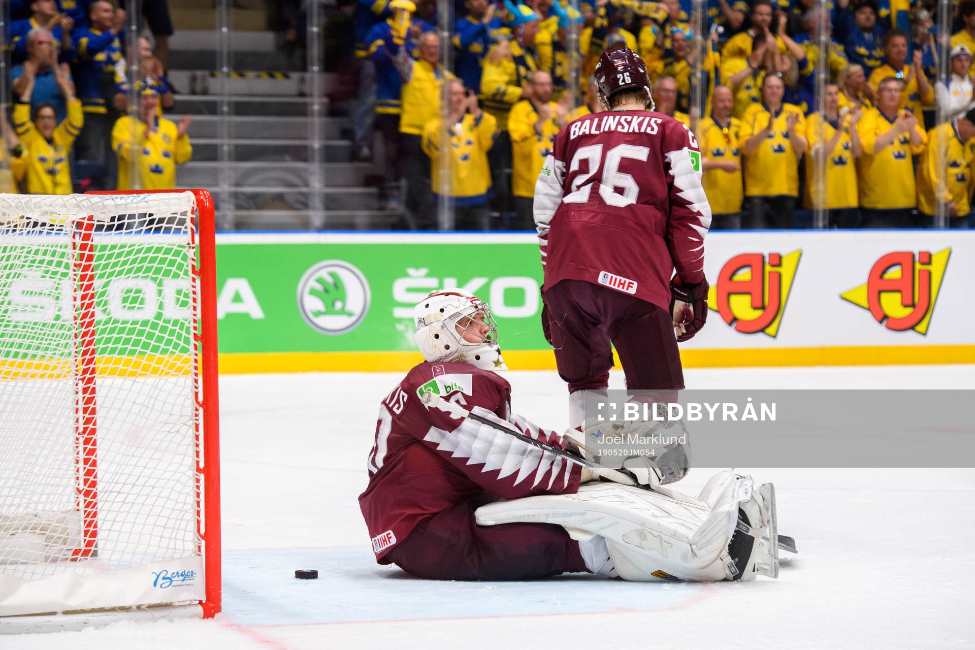 Goaltender Kristers Gudlevskis and Uvis Balinskis of Latvia