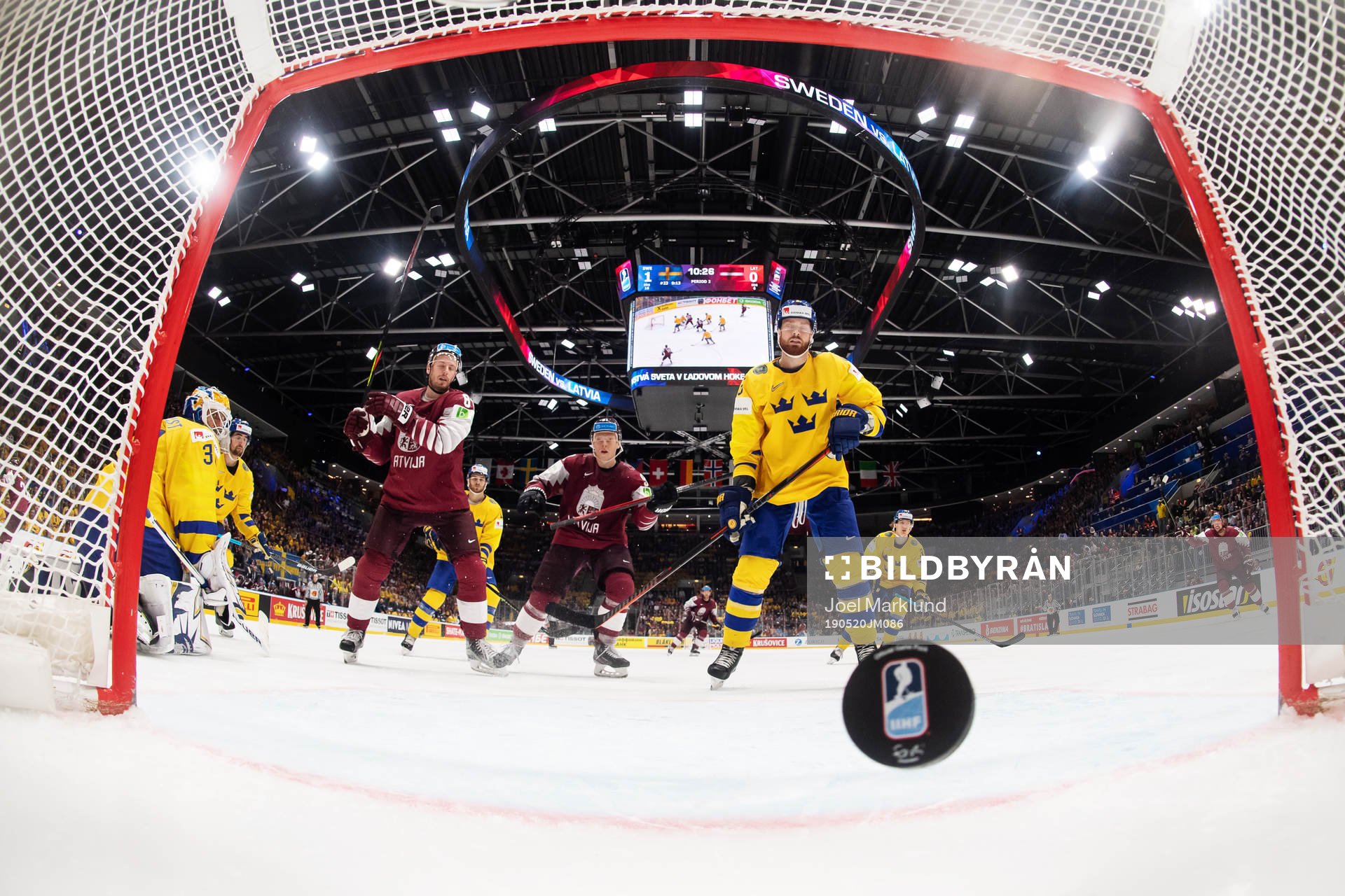 Goaltender Henrik Lundqvist of Sweden lets in the 1-1 goal