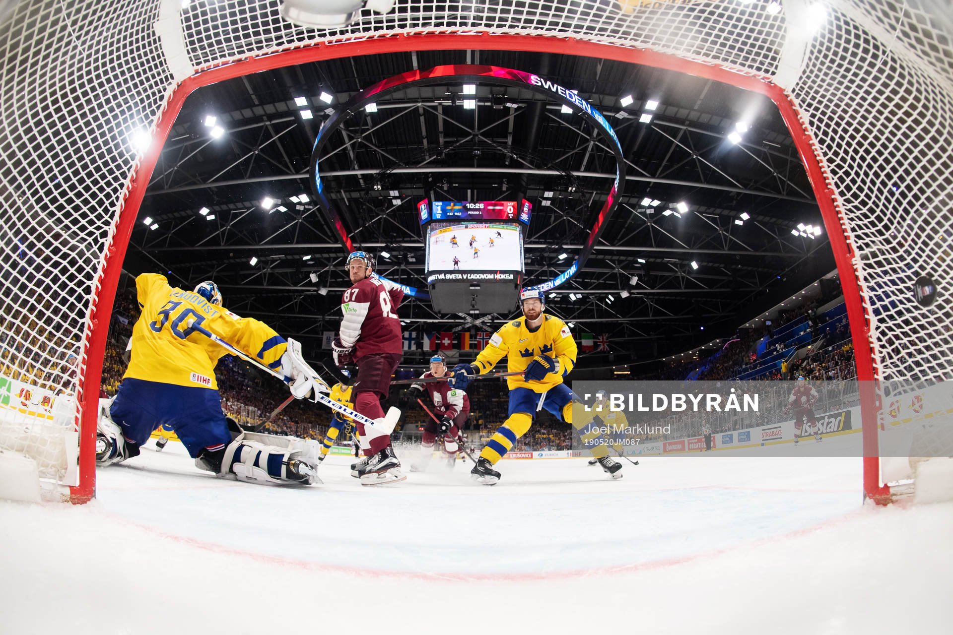 Goaltender Henrik Lundqvist of Sweden lets in the 1-1 goal