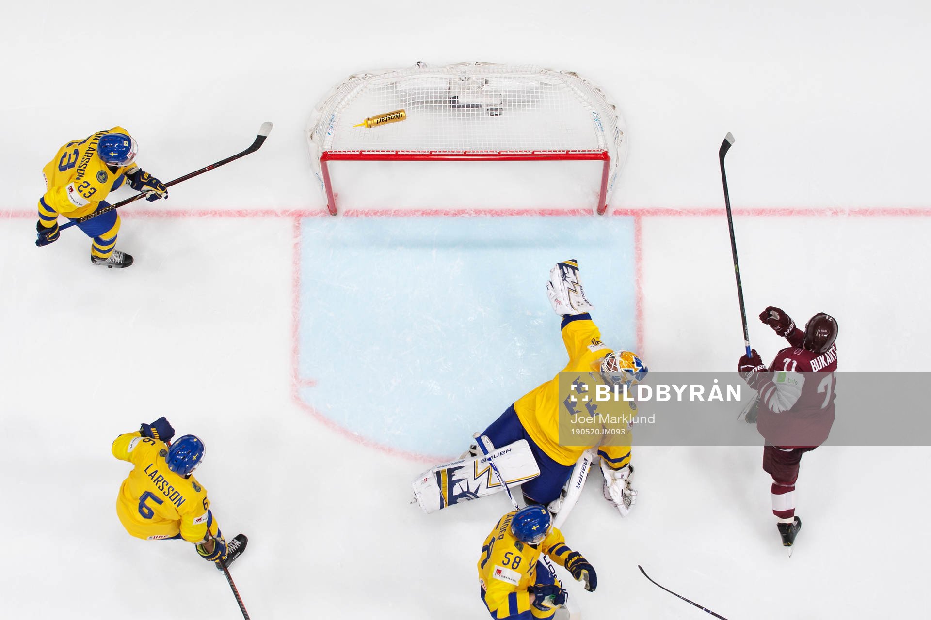 Roberts Bukarts of Latvia scores 4-4 behind goaltender