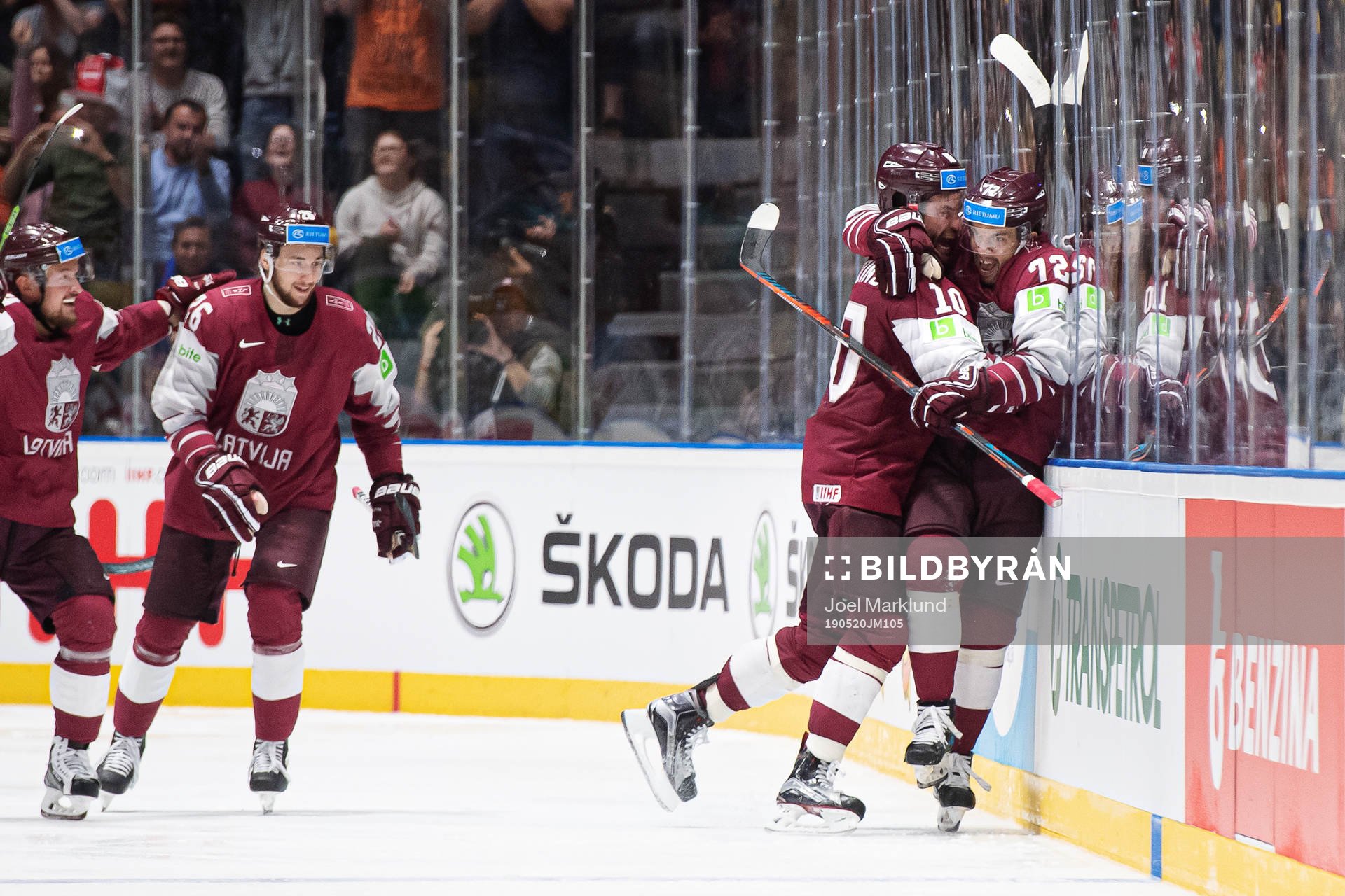 Lauris Darzins and Janis Jaks of Latvia celebrate the 2-3