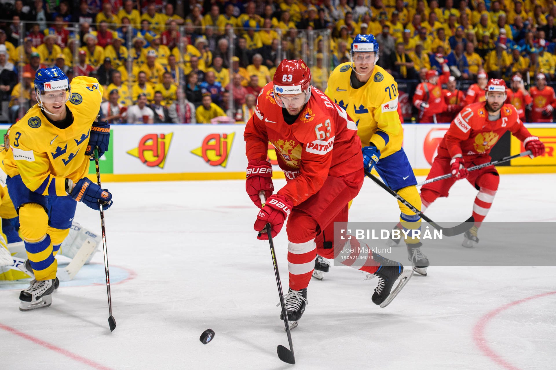 Yevgeni Dadonov of Russia against John Klingberg and Dennis