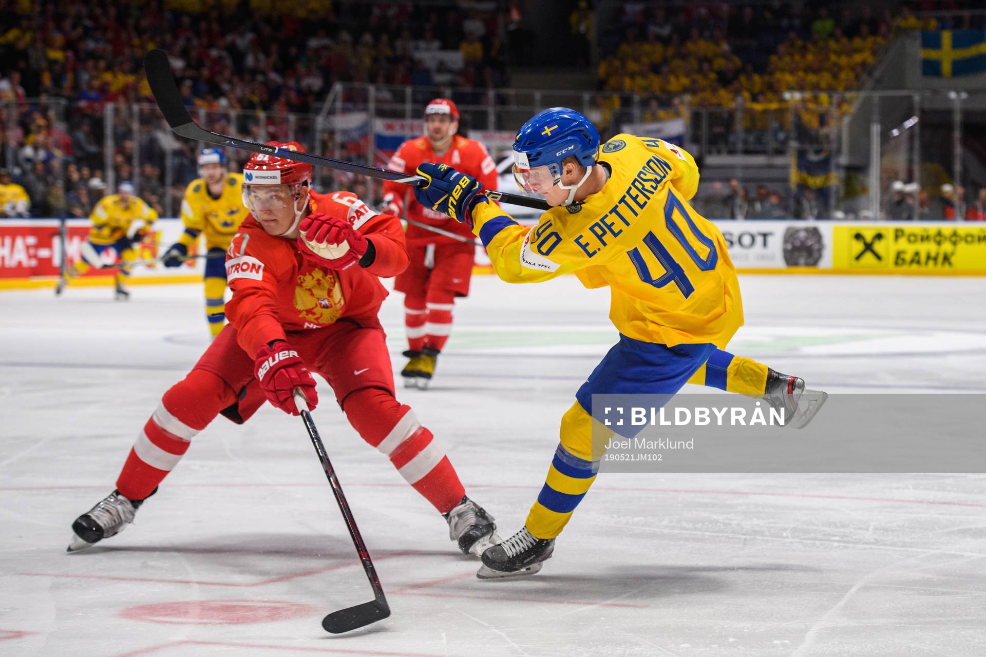Nikita Zadorov of Russia and Elias Pettersson of Sweden