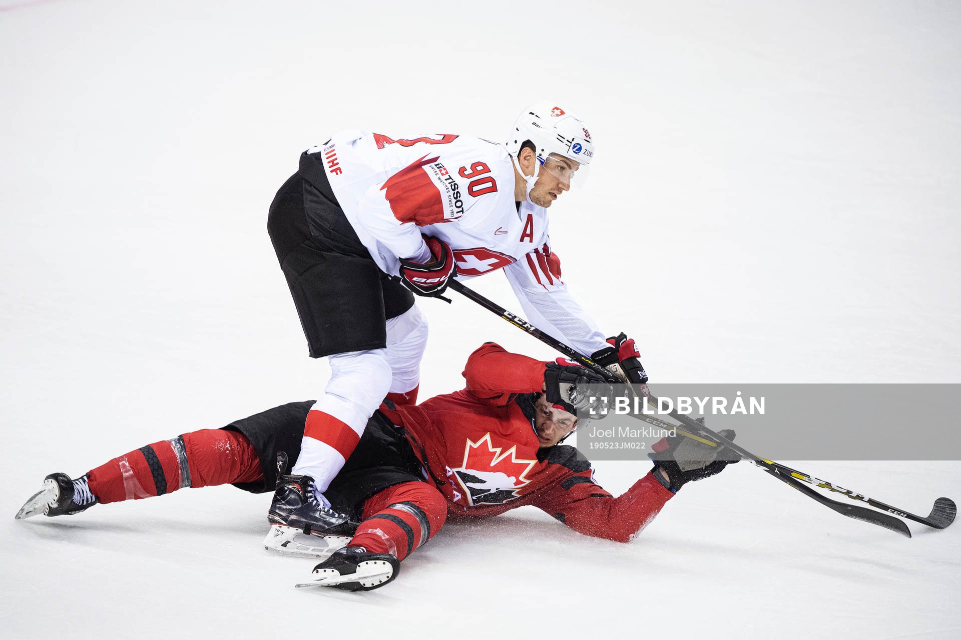 Roman Josi of Switzerland and Anthony Cirelli of Canada