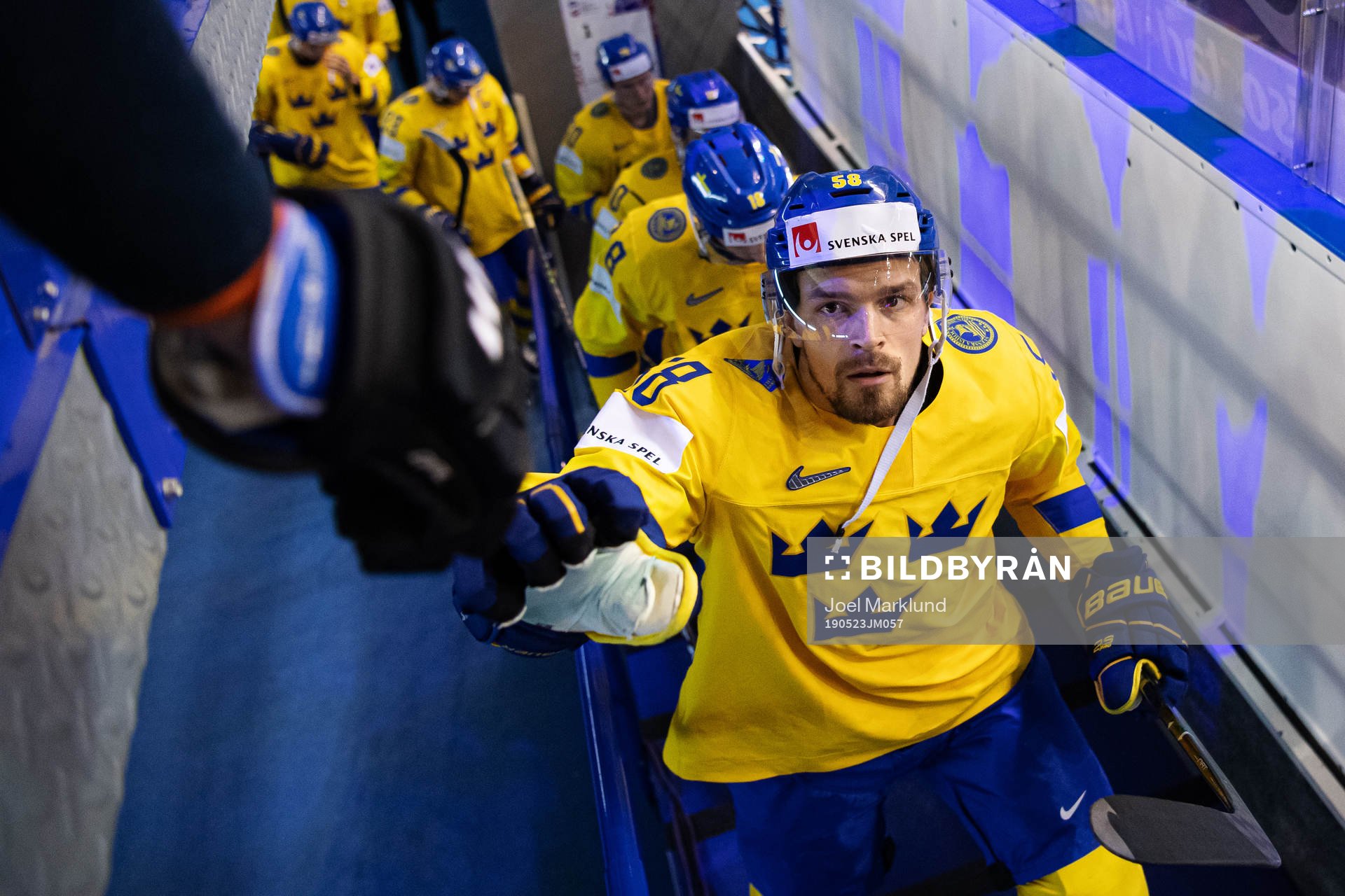 Anton Lander of Sweden fist bumps with a fan