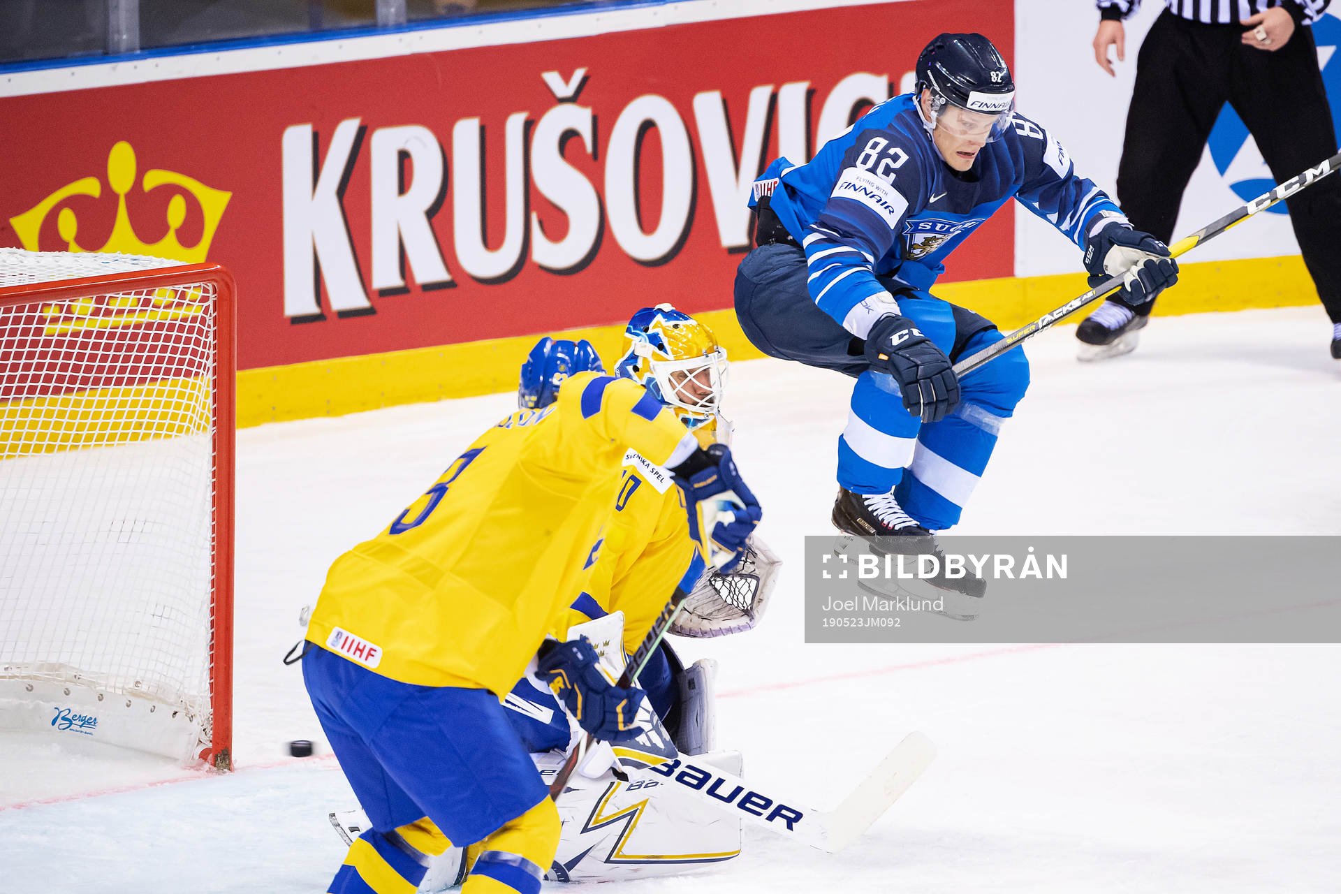 Harri Pesonen of Finland with a jump infront of goaltender
