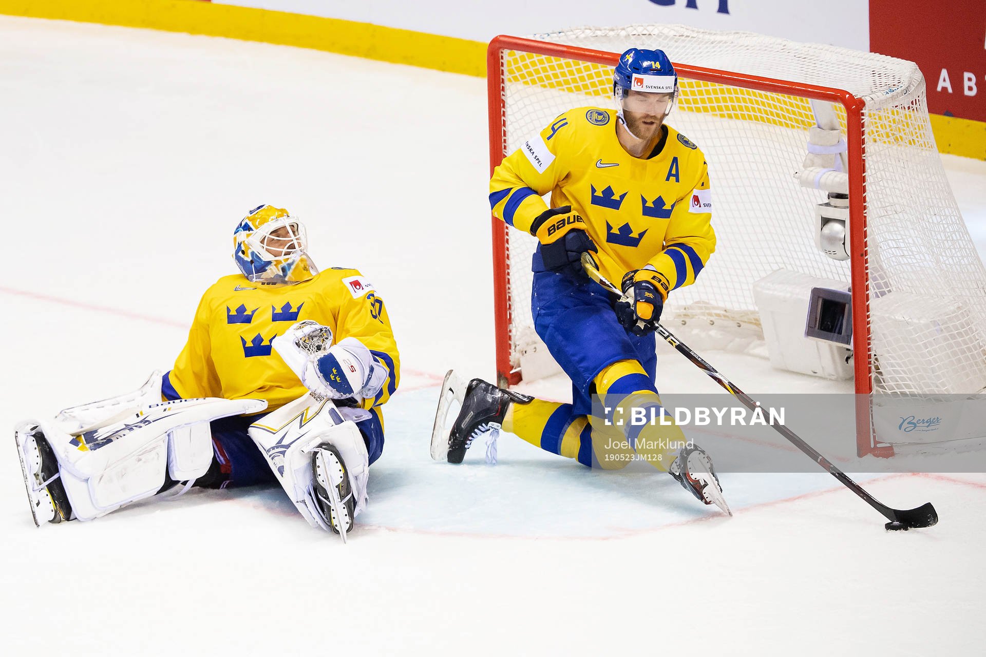 goaltender Henrik Lundqvist and Mattias Ekholm of Sweden