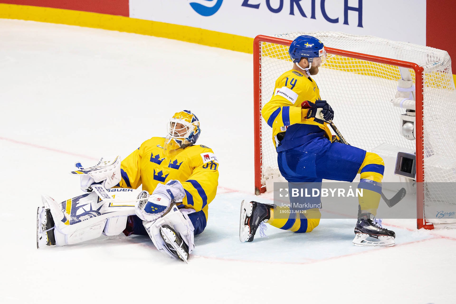 goaltender Henrik Lundqvist and Mattias Ekholm of Sweden
