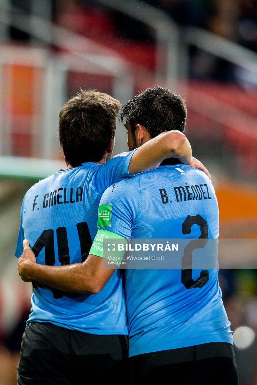 Francisco Ginella of Uruguay celebrates with teammate Bruno