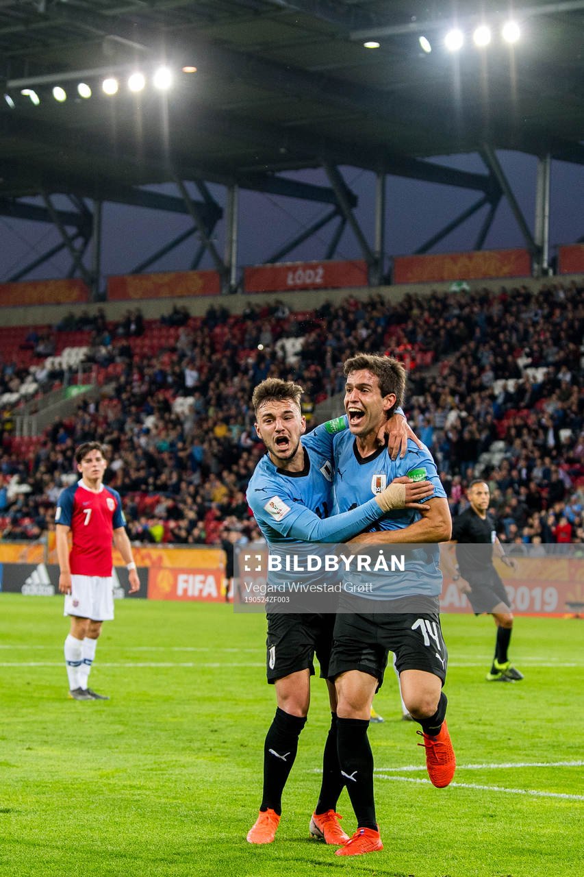 Francisco Ginella of Uruguay celebrates with teammate