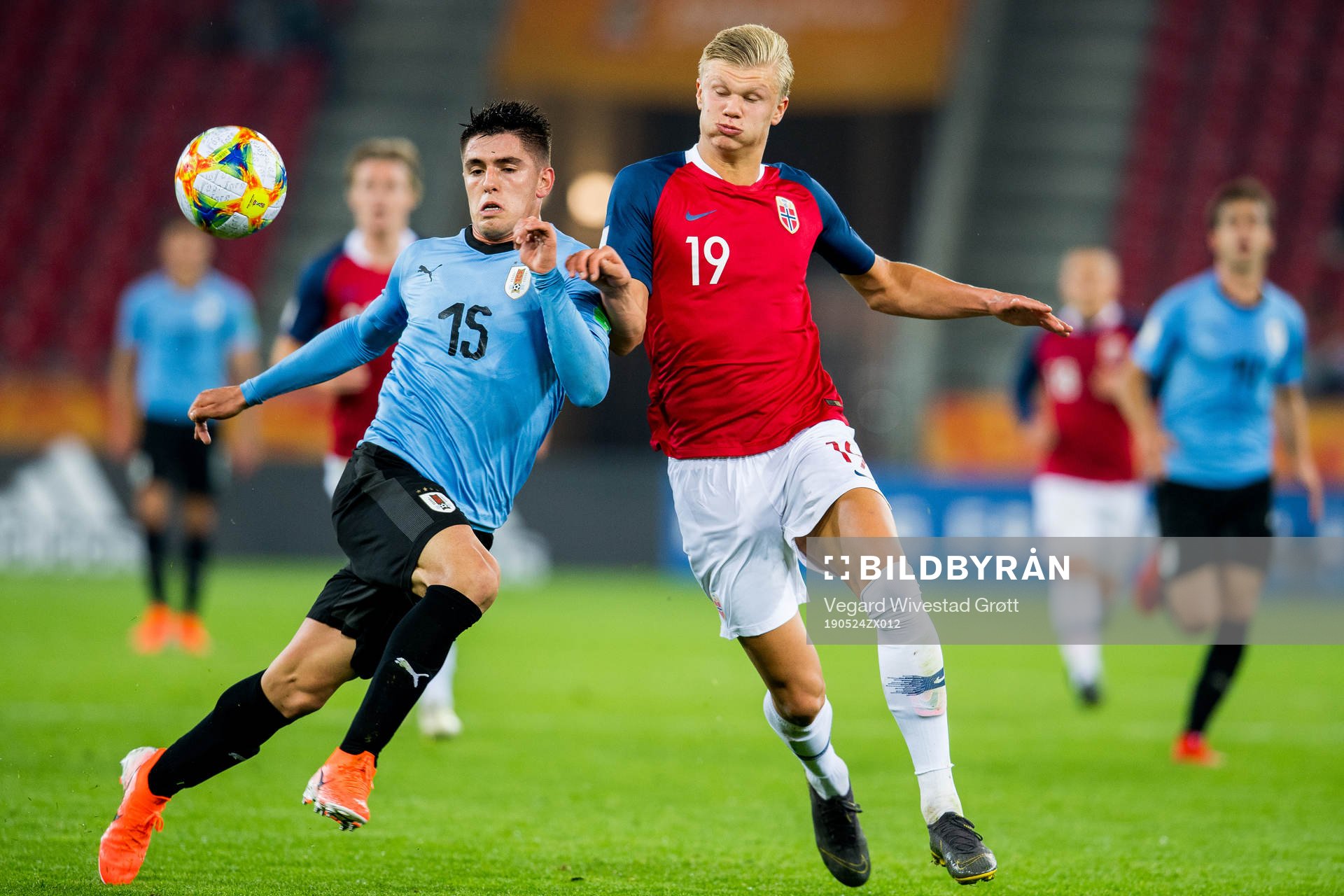 Edgar Elizalde of Uruguay and Erling Braut Haaland of Norway