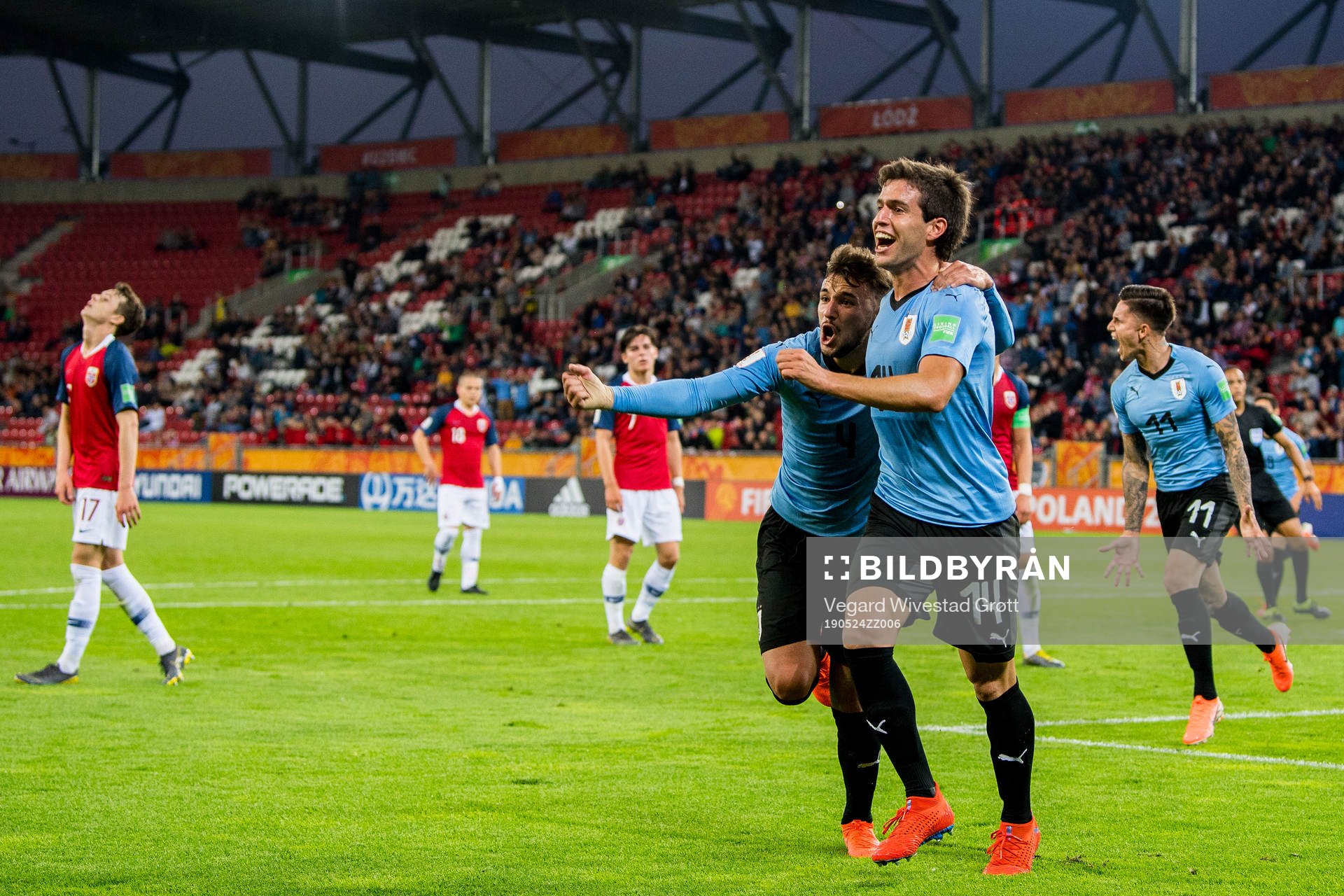 Francisco Ginella of Uruguay celebrates with teammate