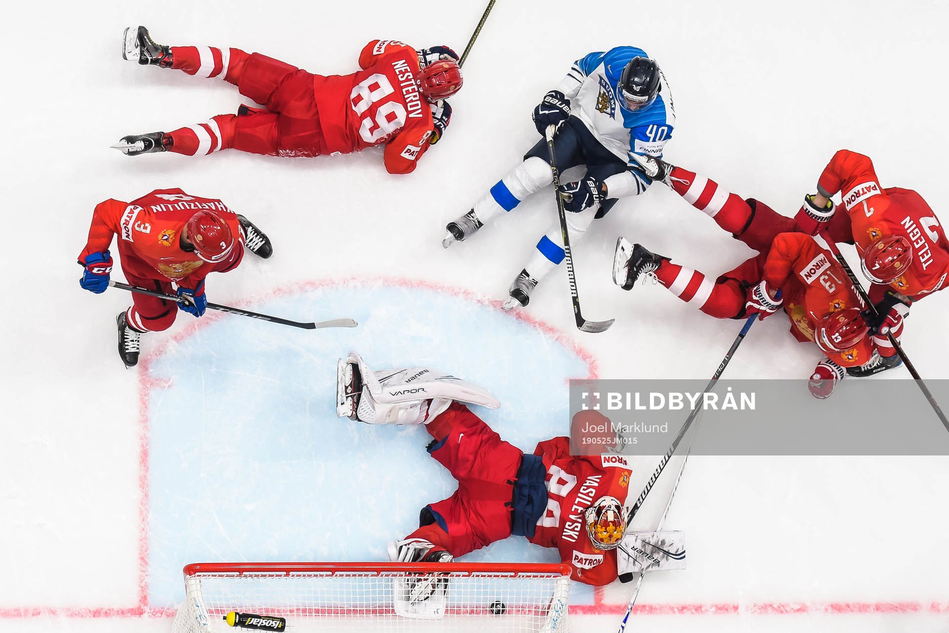 Petteri Lindbohm of Finland against goaltender Andrei