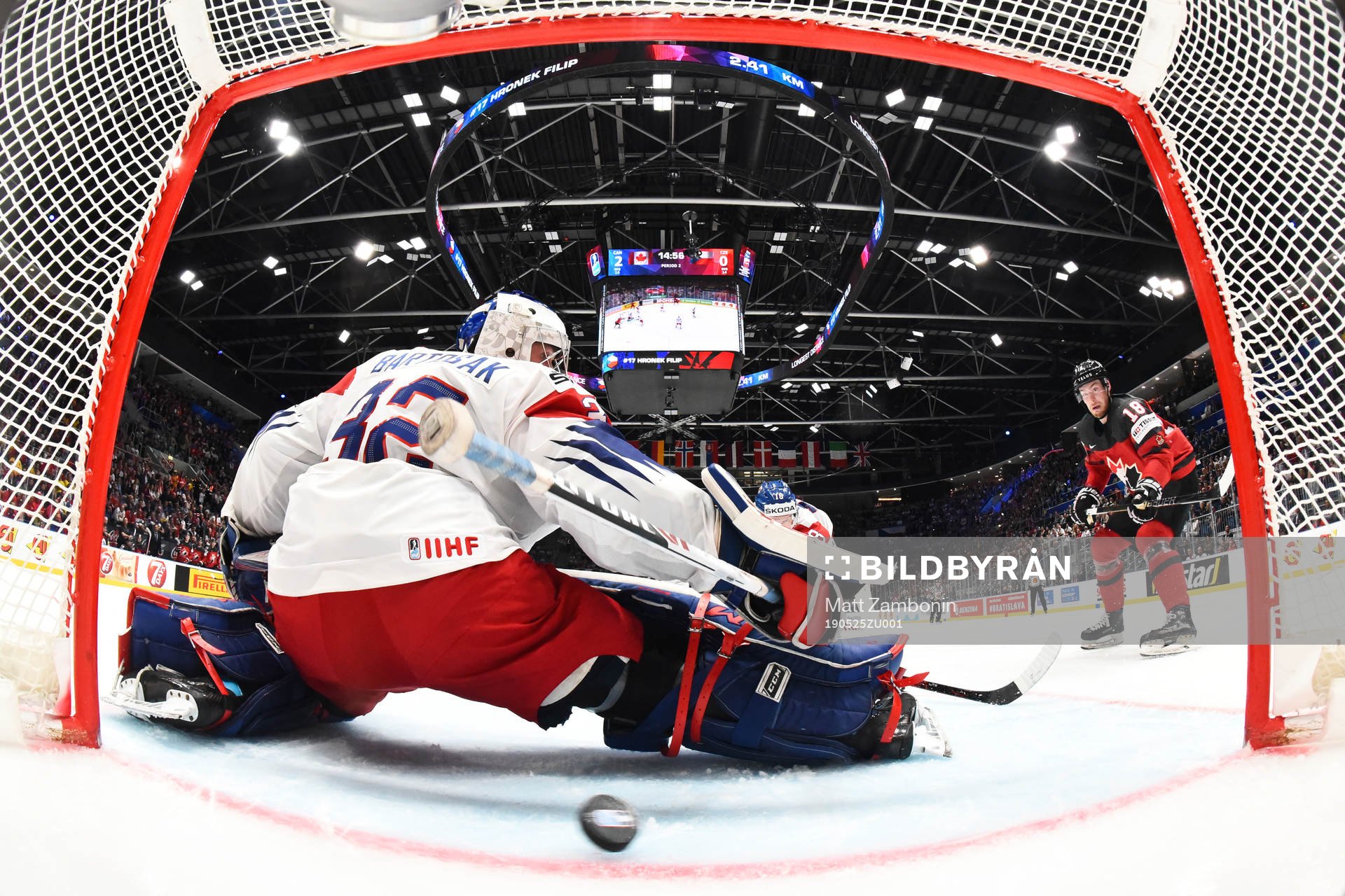 Goaltender Patrik Bartosak of Czech Republic lets in the