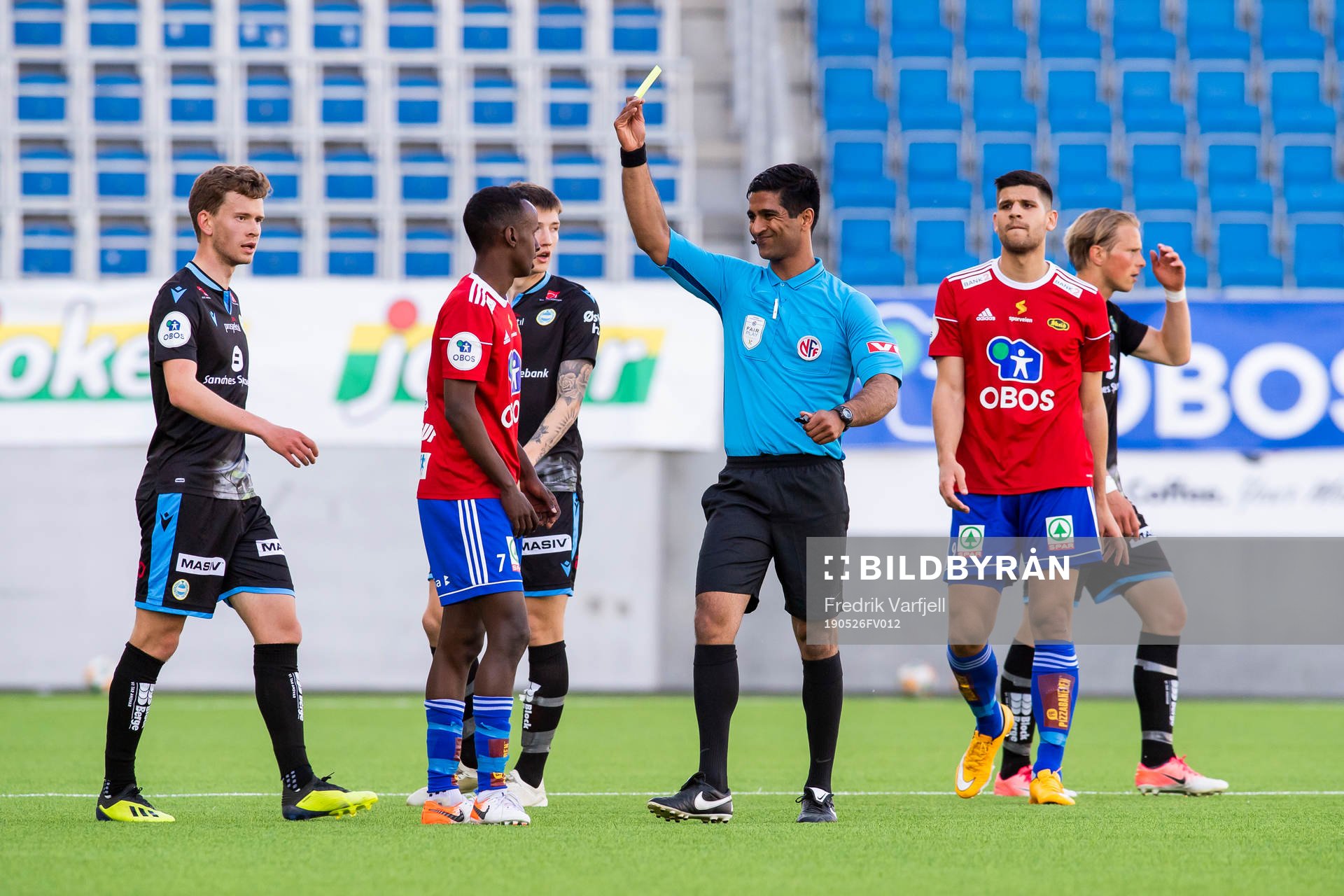 Hassan Mohamed Yousef of Skeid is shown a yellow card by
