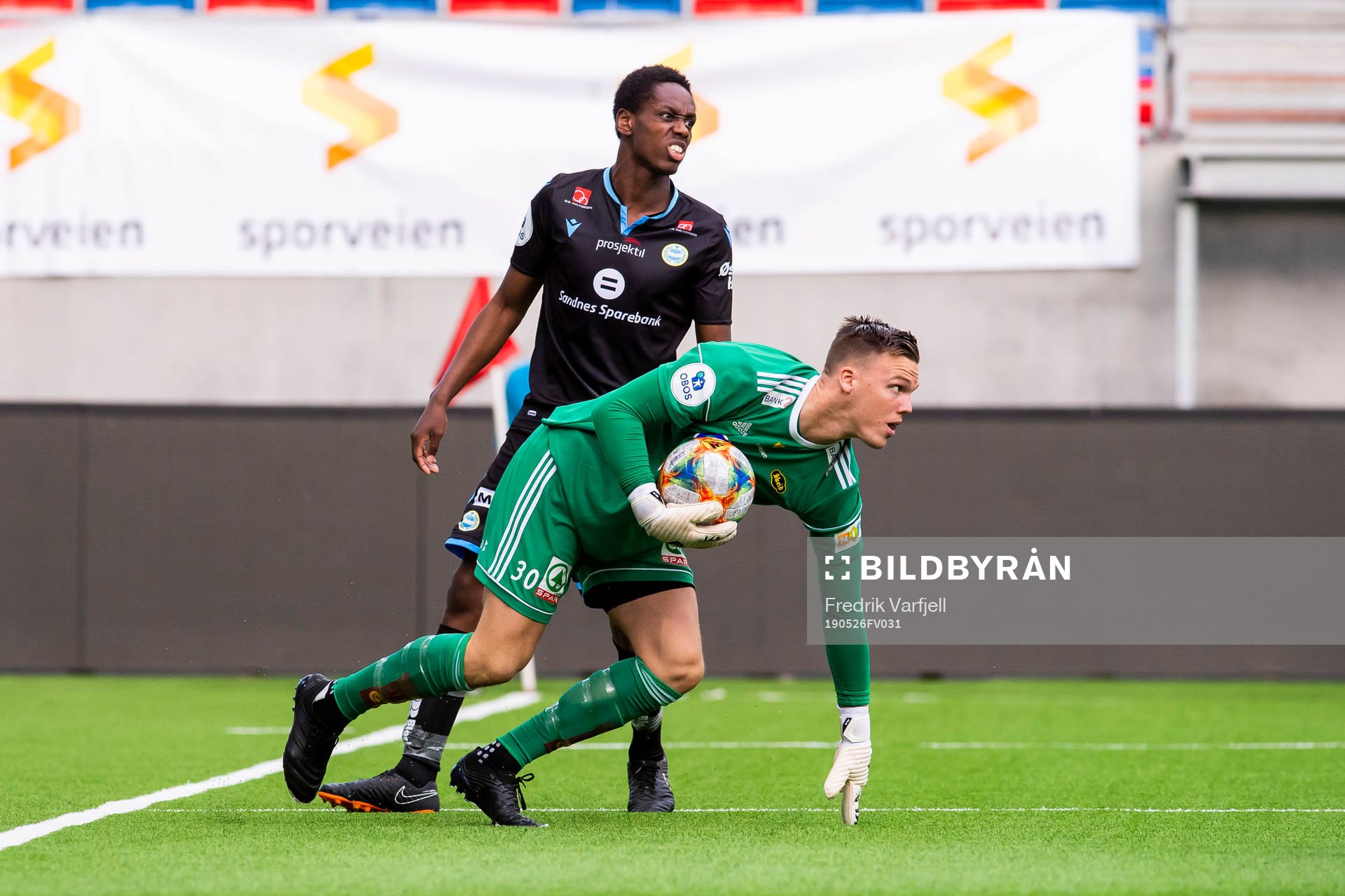 Akinsola Akinyemi of Sandnes Ulf  and goalkeeper Idar