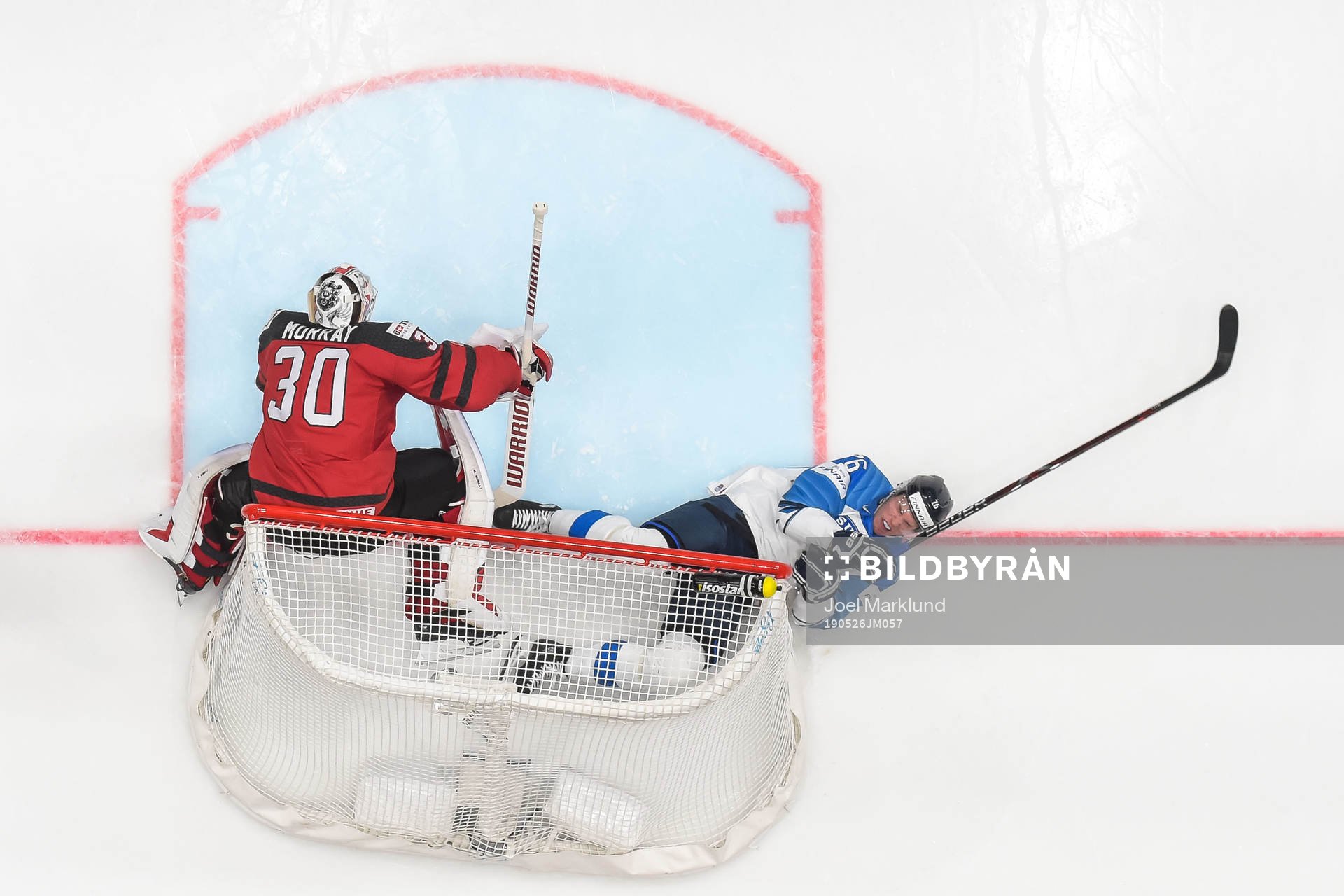 Goaltender Matt Murray of Canada and Jere Sallinen of