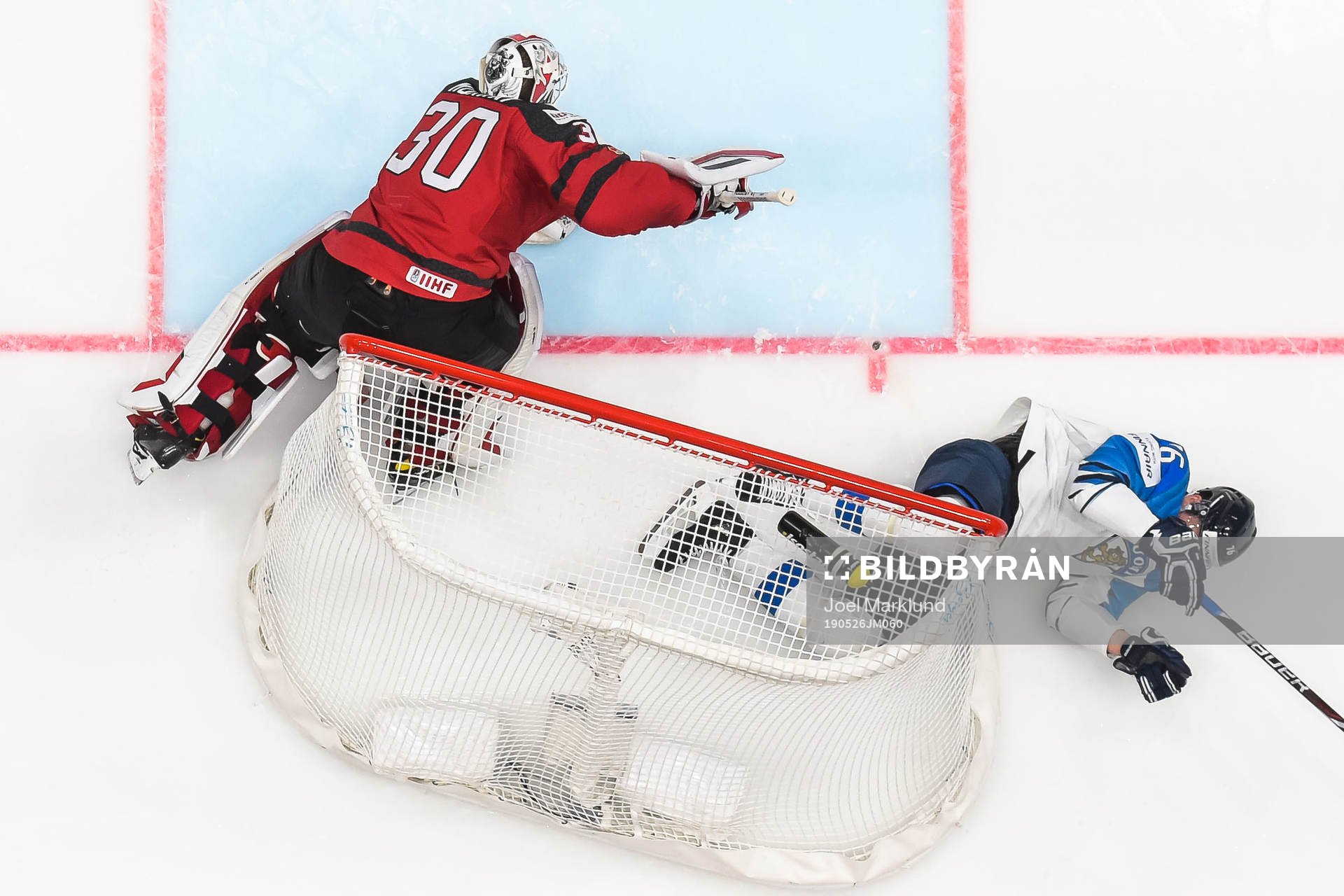 Goaltender Matt Murray of Canada and Jere Sallinen of